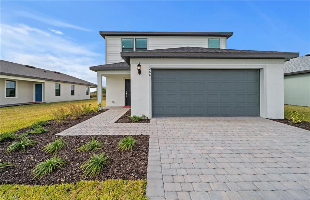 Welcome to this beautifully designed McNair floor plan offering 2,207 square feet of thoughtfully designed living space. This two-story home features 4 bedrooms, 3 full bathrooms, and a spacious 2 car garage, blending style, comfort, and functionality.

The open-concept layout is perfect for entertaining, with the kitchen overlooking the gathering room and dining area. Designer finishes include 42-inch white cabinetry, quartz countertops, a full appliance package, and window blinds throughout. Impact-resistant windows and doors provide added peace of mind and energy efficiency.

A first-floor bedroom and full bath offer the perfect space for guests, a home office, or multi-generational living. Upstairs you'll find a versatile loft, two secondary bedrooms, and private owner's retreat featuring a large walk-in closet, dual vanities, and a spacious walk-in shower. Step outside to the screened-in lanai and enjoy serene preserve views, creating the perfect setting for morning coffee or relaxing evenings. With modern finishes, a flexible floor plan, and a beautiful natural backdrop, this quick-move-in home offers exceptional value and is ready for its new owners.