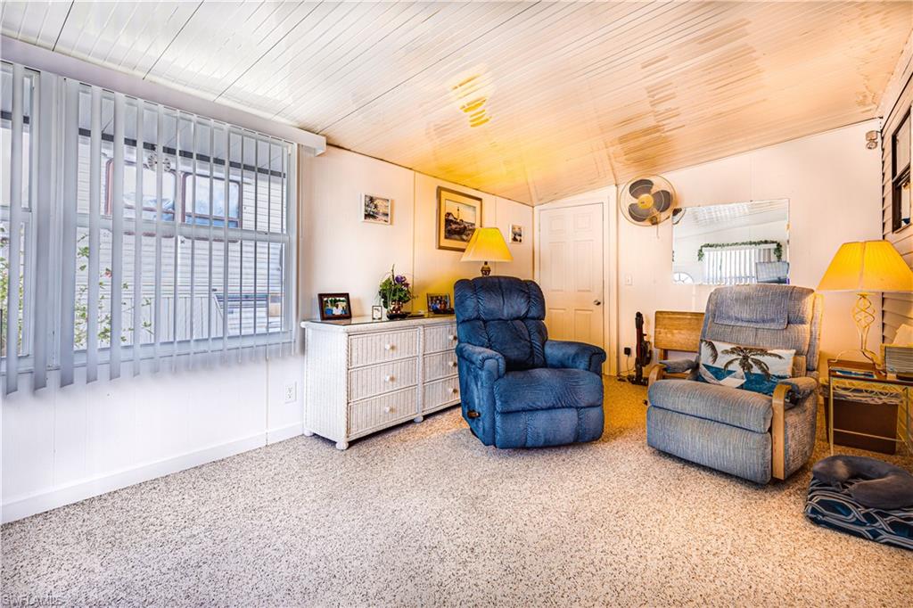 This cute little place is perfect for the retiring couple or single individual!  The lanai has been converted to a comfortable space with a half bath. When you walk in the door you feel like you're right at home. As you enter the park model side, you can see that it has been lovingly cared for and maintained with beautiful laminate floors and lots of windows to let in the wonderful SW Florida sunshine. It has a nice sized utility room with an extra closet and also has an additional storage space. The patio is perfect for picnics and has a pretty green space in the rear of the home for a lovely bonus.  Located in an active, 55 plus, gated community where you own the land.  Close to Walmart, Publix, Walgreens, CVS, and more!  It is only about 8 miles to Marco Island and about 12 to downtown Naples.  This is one you don't want to miss!