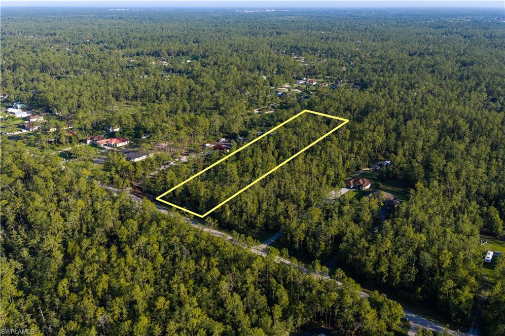 Discover 2.5 acres of natural Florida beauty in the heart of Golden Gate Estates. This oversized parcel offers a rare combination of privacy, space, and a meaningful buildable footprint, surrounded by mature pine, cypress, and cabbage palm. Approximately 1.27 acres of uplands run through the middle and back of the property, providing a solid area to design and site your dream estate, while the natural wetlands (approximately 1.12 acres) toward the front create a lush, private buffer and preserve the tranquil, wooded character of the land. 
Enjoy exceptional peace and quiet in a serene, established area of the Estates, yet remain conveniently close to shopping, dining, A-rated schools, and Naples' world-class beaches. This is acreage living with urban convenience within easy reach. Buyer to perform their own due diligence. Wetland report available in supplements.