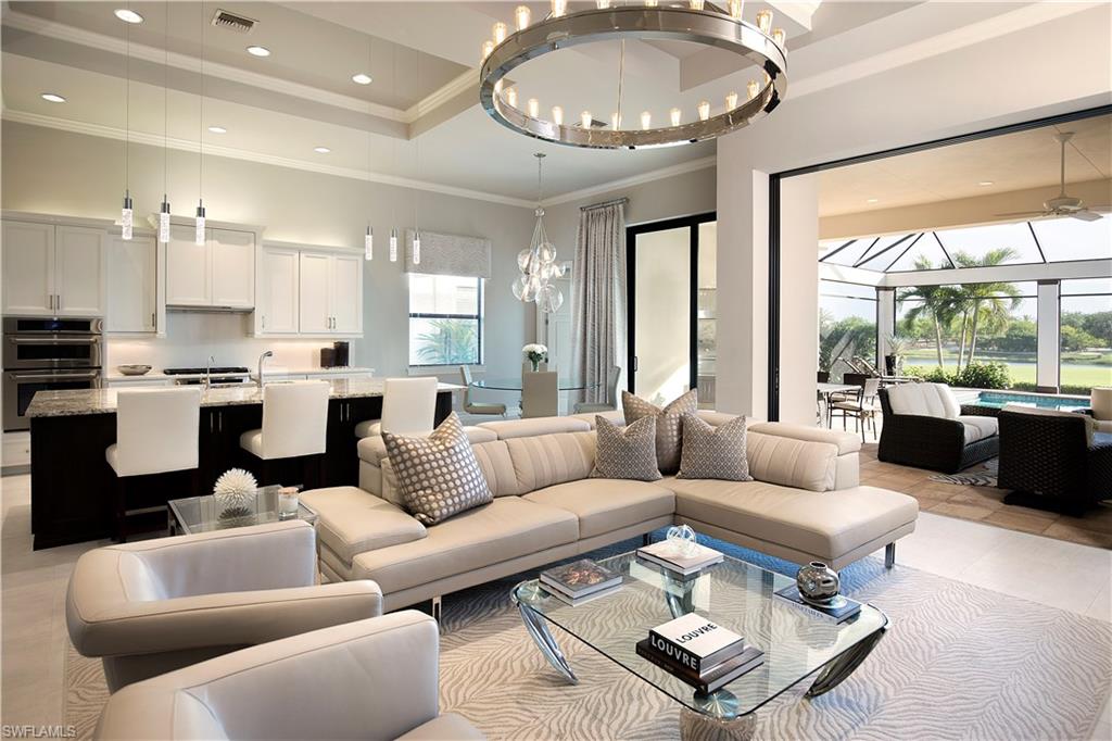 This exquisite Harbourside Villa Adrianna Model in Brightling features 2,622 spectacularly appointed sq ft under air plus another 2100+ sq ft SW facing spectacular lanai.  The expansive gallery entry hallway leads thru an open concept great room with a wall of pocketing glass slider that opens to the enourmous outdoor living space featuring a salt water pool, outdoor shower, gas fireplace, outdoor kitchen with dining area and adjacent conversation area.  The home has 3BR/3 + 1/2 BA , den/study and a 3 stall garage.  The well appointed gourmet kitchen showcases a large granite island and is situated adjacent to an open dining area with sliders leading to the outdoor kitchen and dining area.  Upgraded lighting, speakers, closets and floors throughout. Extraordinary lake and golf course view of the 11th hole!  Talis Park features an 18 hole Tier 1 rated golf course that is the only Greg Norman/Pete Dye Golf course in the region and one of only two courses in the world designed by the duo. The Vyne House, Fiona's Cafe', Esprit Spa, 24 hour fitness center, dog park, tennis courts, bocce and a new sports pub are amongst the neighborhood's many amenities.