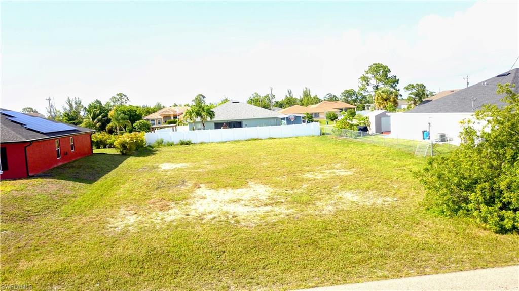 Build your dream home on this beautiful 1/4-acre vacant lot in Cape Coral! Located in a great neighborhood,
this property offers an excellent opportunity to invest in one of Southwest Florida’s most desirable areas.
Situated across the street from waterfront properties, you’ll enjoy the feel of a premium location without the
waterfront price tag. The surrounding area features well-maintained homes, peaceful streets, and convenient access to shopping, dining, schools, parks, and everything Cape Coral has to offer. Whether you’re ready to build now or looking to secure land for the future, this lot is a fantastic option in a growing community. Don’t miss your chance to own a piece of paradise in Cape Coral!
