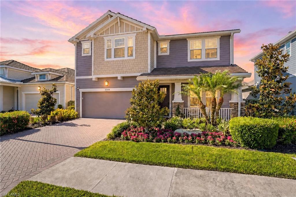 ANNUAL RENTAL NOW AVAILABLE! Built in 2021 and extensively upgraded with over $125,000 in enhancements, this beautifully appointed two-story residence offers four bedrooms, a private office, 3.5 baths and a spacious upstairs loft. Thoughtfully designed throughout, the home showcases soaring ceilings, refined finishes and a clean, cohesive aesthetic that feels both sophisticated and welcoming. The kitchen serves as the centerpiece of the home, featuring quartz countertops, premium KitchenAid® appliances, custom cabinetry, a designer backsplash and an oversized sink. The space opens seamlessly to the main living and dining areas, where plank tile flooring and curated lighting selections enhance the home’s modern yet timeless appeal. Privately situated on the first floor, the primary suite offers a peaceful retreat complete with dual vanities, a walk-in shower and an expansive custom walk-in closet. Upstairs, additional guest bedrooms and a generous loft provide flexible living space ideal for a media room, lounge or secondary gathering area. Each bedroom also includes its own walk-in closet for added comfort and convenience. With desirable southern rear exposure, the outdoor living area is filled with natural light and overlooks tranquil lake views. Mature privacy hedging creates a peaceful and secluded backdrop, ideal for entertaining or enjoying quiet evenings outdoors. Additional features include impact-resistant windows and doors, dual air-conditioning systems, a whole-home water filtration system, integrated security cameras and substantial attic storage. In the gated community of Compass Landing, residents enjoy access to a clubhouse, resort-style pool and spa, fitness center and a tot lot. The community is conveniently near top-rated Collier County schools, Founders Square, shopping, dining and everyday conveniences. A beautifully upgraded residence offering modern comfort, thoughtful design and an exceptional Naples lifestyle.