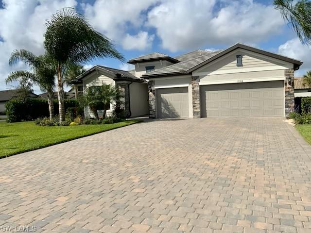 This stunning home, located on a sprawling corner lot, boasts three bedrooms, one den, and three bathrooms, while the three garages provide ample space for your vehicles. Step inside, and you'll be captivated by the spacious and well-designed interiors. The living spaces are flooded with natural light. The heart of this home is undoubtedly the huge kitchen island, a focal point for culinary enthusiasts and a hub for social gatherings. This home is a move-in-ready experience. Beyond the confines of the house, the community is reminiscent of a resort, providing residents with a lifestyle of leisure and recreation that includes a resort-style swimming pool with a waterfall, restaurant, cafe, gym, pickleball, and tennis court. This property is not just a house; Immerse yourself in this meticulously maintained home, where every detail has been thoughtfully curated. See and make it your forever home.