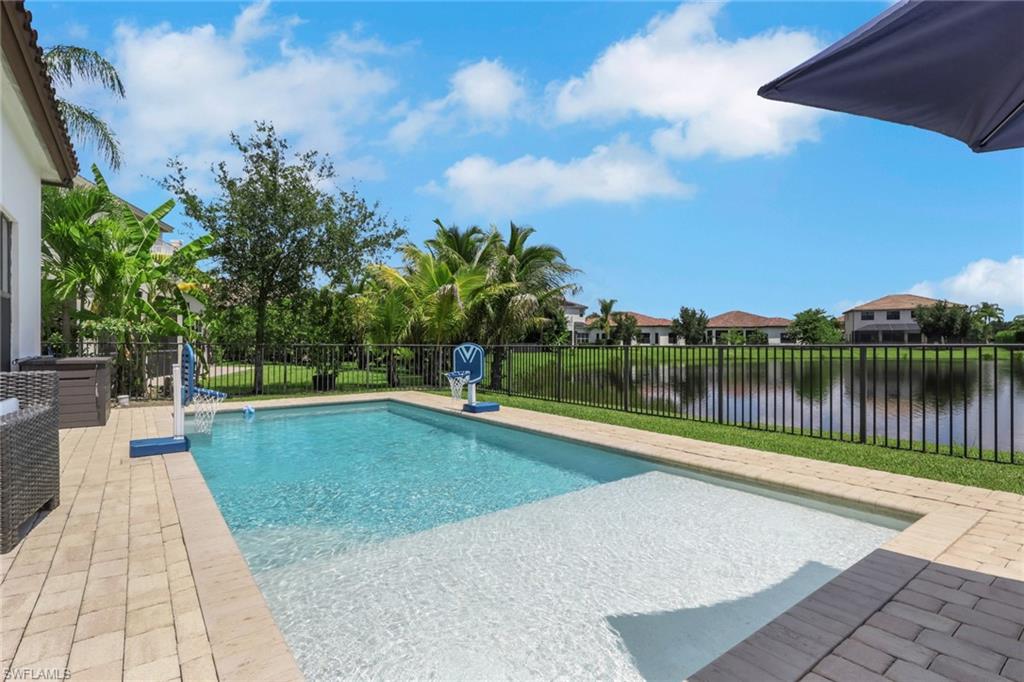Exceptional value awaits with this beautifully upgraded Bristol model, listed $71,000 below its recent appraised value. Offering an incredible opportunity to own a move-in-ready waterfront home with a custom pool in the highly desirable Maple Ridge at Ave Maria, this residence features 3 bedrooms plus a den, 3 full bathrooms, and 2,341 square feet of thoughtfully designed living space. The floor plan features two spacious living areas, creating an open and inviting atmosphere ideal for both everyday living and entertaining. Interior upgrades include crown molding, tray ceilings with decorative crown accents, tile flooring main living area, laminate flooring in bedrooms, granite countertops throughout, and expanded cabinetry. The well-equipped kitchen is sure to impress with upgraded rounded corners, new refrigerator, breakfast bar, custom finishes, and generous cabinet space.
The primary suite serves as a relaxing retreat, complete with beautiful lake views, a spacious walk-in closets with full length mirrors, dual vanities, a soaking tub, and a separate walk-in shower. Two additional bedrooms, three full bathrooms, and a flexible den provide plenty of room for guests, a home office, or additional living space to fit your needs. Enjoy the best of outdoor living from your private backyard oasis featuring a custom pool, spacious paver patio, fenced yard, and serene waterfront setting—perfect for enjoying Southwest Florida's year-round sunshine.
Additional features include new solar system ($50-$70 monthly electric bill), blinds throughout, a new water heater, dedicated laundry room, Mediterranean-style tile roof, paver driveway, paved walkway on both sides of the house, irrigation system, and a finished two-car garage. Maple Ridge residents enjoy access to exceptional amenities including a resort-style clubhouse with a swimming pool, fitness center, sauna, playground, billiards room, walking trails, and dog park. You'll also appreciate everything Ave Maria has to offer, including parks, tennis and pickleball courts, a water park, shopping, dining, Publix, nearby golf, and a vibrant town center. This exceptional home offers the lifestyle you've been looking for in one of Southwest Florida's most sought-after communities. Ave Maria where community meets paradise!