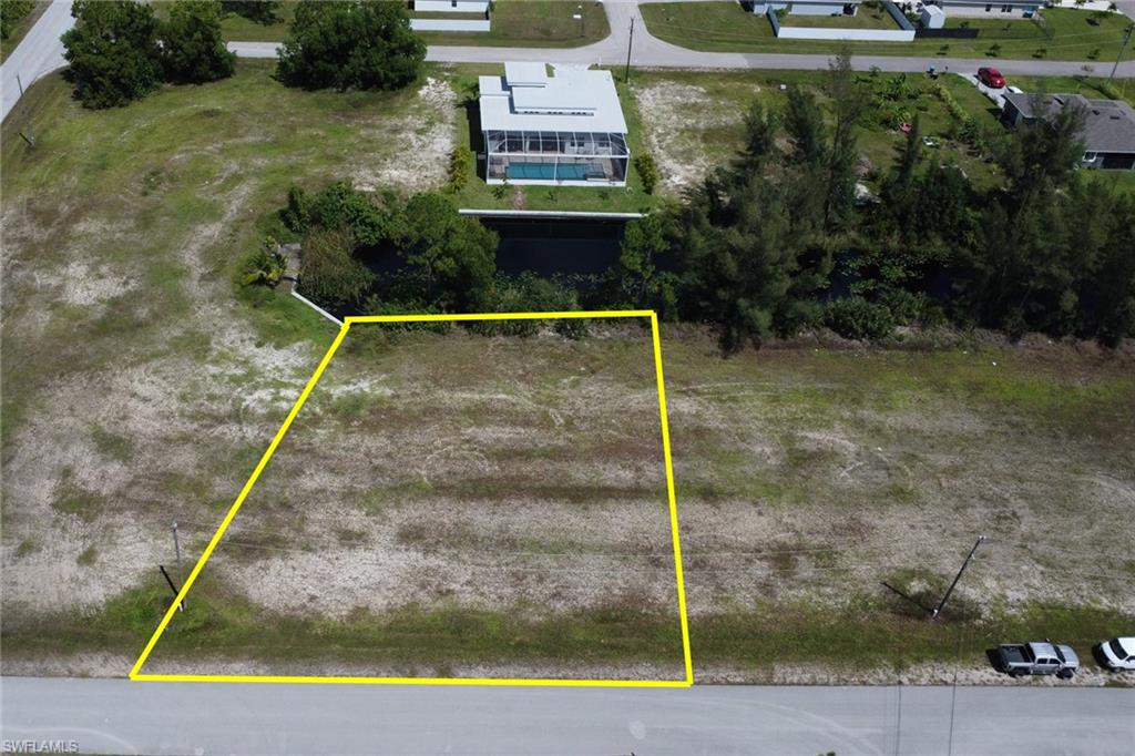 Excellent opportunity to own this oversized freshwater canal lot, encompassing 0.28 acres of prime real estate in this booming section of Cape Coral. Situated on a freshwater canal, this lot is the perfect canvas to build the masterpiece home you've always dreamed of. Zone X, no flood insurance required! The adjacent lot at 801 NE 38th Ter and 3819 Andalusia Blvd, are also available for purchase, combining for nearly an acre of land. Build a single grand estate or multiple homes. This is a rare chance to secure a large parcel in a rapidly growing area. Whether you envision a luxurious single estate or multiple homes, the possibilities are endless. No assessments due at this time. Inquire today for more details!
