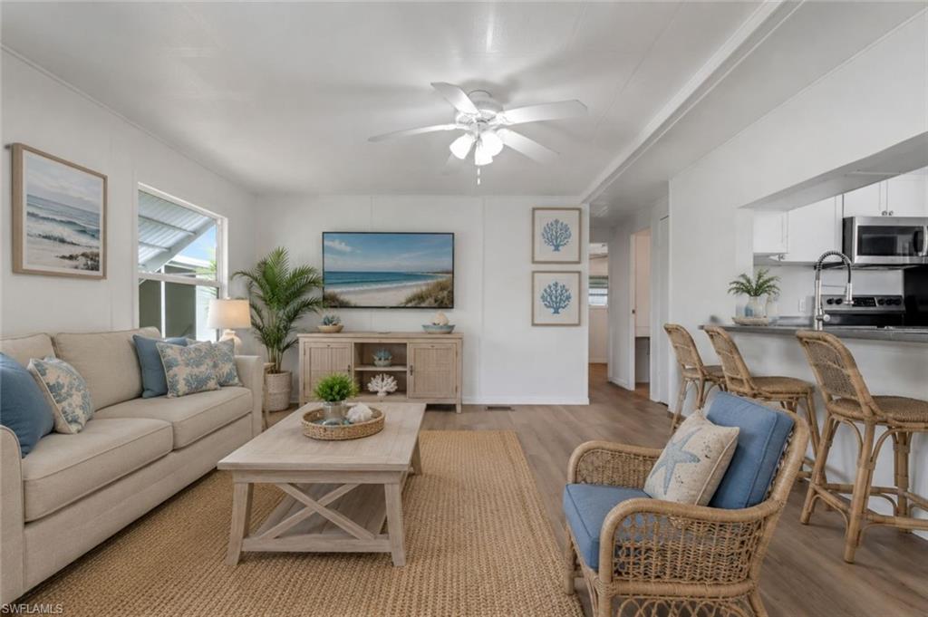 Priced to sell and easy to show! Seller financing is available, offering a fantastic opportunity to own an affordable home in Orange Harbour, a gated 55+ waterfront co-op community.

Enjoy the Southwest Florida lifestyle in this remodeled 2-bedroom, 1.5-bath manufactured home nestled along the Caloosahatchee and Orange Rivers. This move-in-ready home features luxury vinyl plank flooring throughout, a newer central A/C system, newer water heater, and an updated kitchen with shaker-style cabinetry, granite countertops, and stainless-steel appliances. A dedicated laundry room with a washer and dryer, spacious screened lanai, and covered carport with room for both your vehicle and golf cart complete this inviting home.

Orange Harbour is an active, resident-owned cooperative where neighbors take pride in ownership and enjoy a true sense of community. The monthly maintenance fee of just over $400 offers outstanding value and includes water, sewer, high-speed internet/Wi-Fi, and the upkeep of the beautifully maintained grounds and amenities. Residents also enjoy a healthy reserve fund, providing added confidence in the community's long-term financial stability.

Amenities include a heated pool, clubhouse, community center, boat ramps with direct access to the Caloosahatchee and Orange Rivers, fishing dock, pickleball and tennis courts, bocce ball, and a full calendar of social events and activities. Conveniently located just minutes from downtown Fort Myers, shopping, restaurants, entertainment, and medical facilities.

Whether you're searching for a full-time residence or the perfect seasonal getaway, this home offers exceptional value and a low-maintenance lifestyle in sunny Southwest Florida.  Easy to show and ready for its new owner—schedule your private showing today!