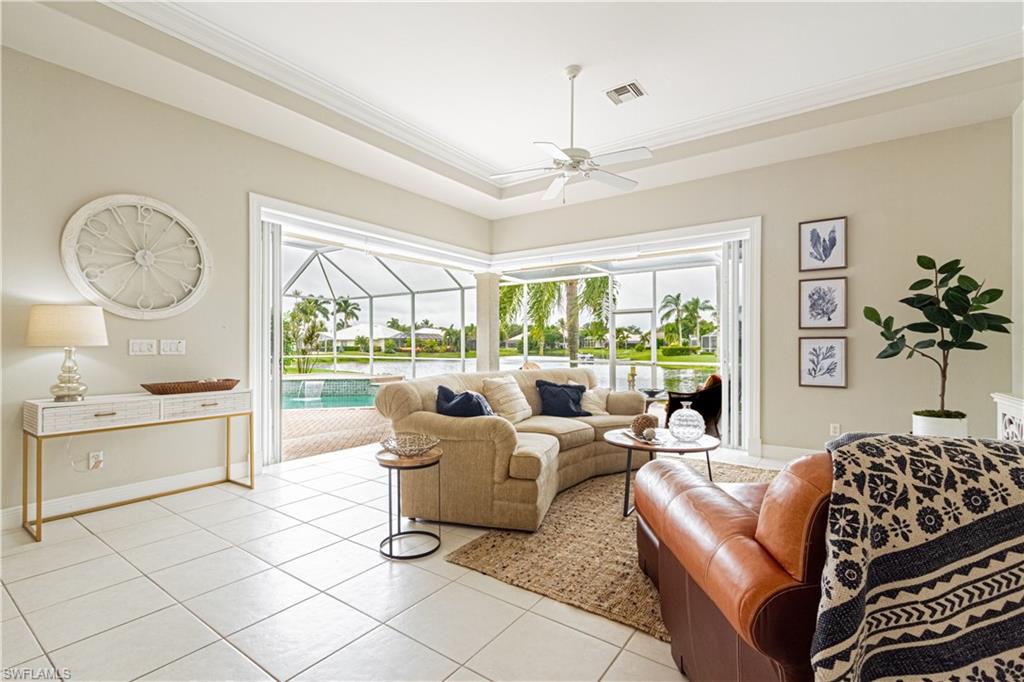 Here's the home you've been waiting for. This 4 bedroom/3 full bath Lakefront gem has it all: An updated kitchen with stainless steel appliances, pantry cabinet with pull out drawers, Spacious Open floor plan with Zero Edge slider that expands onto the oversized pavered lanai with coveted Western Exposure, Heated Pool, Lake view and private dock.  Additional features include luxury wood laminate and Tile throughout, Wet Bar, separate dining room and formal living room, plantation shutters, Arched windows, motorized and manual sun shades.  The Master Suite boasts gorgeous lake views and a master bath with walk in shower and Jetted Jacuzzi Tub.  The Ensuite Guest room also boasts an exquisite lake view.  Pavered Driveway, 2 car garage AND a large separate Air conditioned Attic space for storage. Longshore Lake is a sought after gated community in North Naples Featuring an 88 acre lake for boating, kayaking ,fishing and paddle boarding, Clubhouse with restaurant, bar and outdoor dining, swimming pool, 9 Har Tru tennis courts with full time Pro, fitness room and social activities.  Great Location and close to shops, restaurants and Beaches. Do not miss this one!