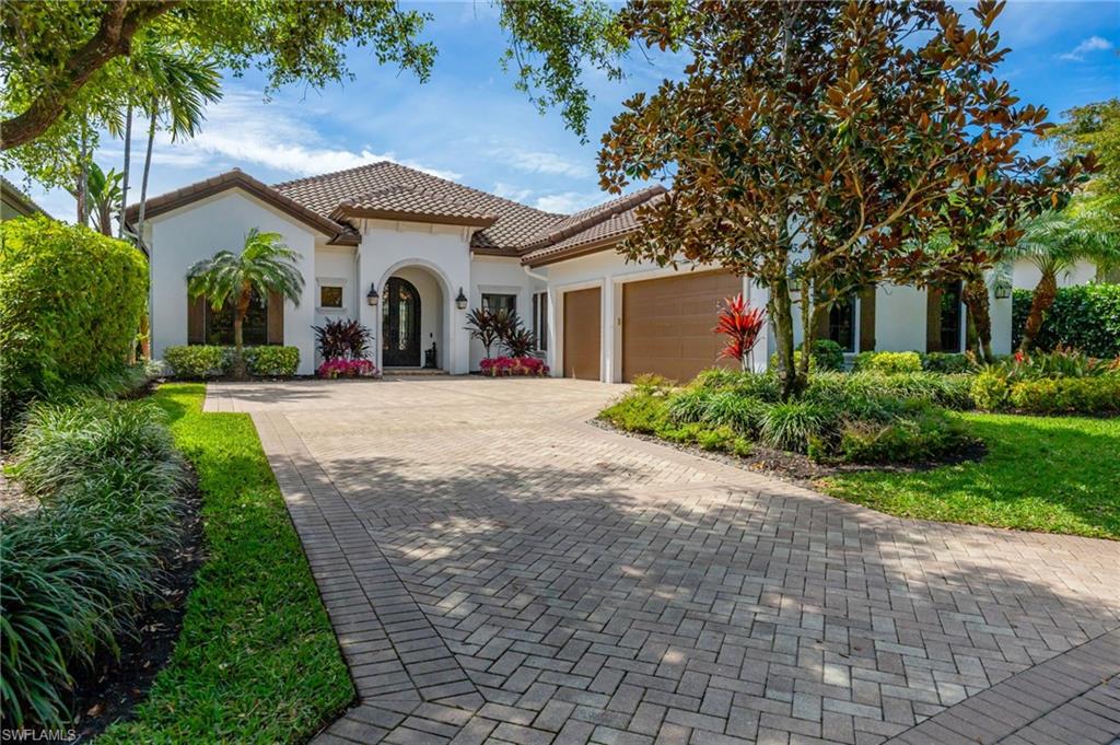 Welcome to a refined expression of Florida luxury living in Talis Park- where modern elegance meets a vibrant golf course lifestyle and offering IMMEDIATE GOLF MEMBERSHIP AVAILABILITY (at closing) allowing you to bypass the waitlist.  This stunning one-story custom home is perfectly positioned along the community's championship golf course, providing breathtaking lake and fairway views framed by lovely landscaping.  Designed for both comfort and sophistication, the residence features three spacious bedrooms plus a private den/home office, ideal for remote work or quiet retreat.  At the heart of the home, the fully remodeled gourmet kitchen showcases high-end appliances (Gaggenau and Thermador), custom cabinetry, built in wine cooler, and an expansive island which is perfect for entertaining or everyday living. The open concept design flows seamlessly into the main living area.  No carpet found in this home, only stunning Italian wide plank tile.  Step outside to your private oasis where indoor and outdoor living blend effortlessly.  The saline pool and spa overlook tranquil water and the manicured golf course, creating a serene backdrop for relaxation.  The summer kitchen elevates outdoor entertaining, making it easy to host gatherings year-round in true Southwest Florida style.  A whole house generator provides further peace of mind. The spacious laundry room with an abundance of built in cabinetry is a welcome bonus. Set within Talis Park, residents enjoy an amenity rich community known for its award winning clubhouse, fitness center, social lifestyle, tennis and pickleball courts, bocce, two dog parks and numerous dining venues. Perfectly situated between downtown Naples and RSW airport and minutes to the gorgeous Gulf beaches!