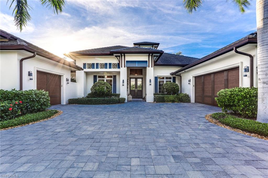 A sought after all-one-level home on a deep oversized lot. Positioned with a western exposure, this custom home spans over 4,300 sq. ft. of interior living spaces that transition effortlessly to the outdoors. Wood floors, detailed ceilings, a chef’s kitchen with Thermador appliances including a gas cooktop, two dishwashers, and a Sub-Zero refrigerator. A spacious master suite with morning bar and resort-style bathroom with separate vanities, water closets, and outdoor shower are just a few of the highlights of this extraordinary home. Two additional en suite bedrooms and private study occupy the main house while a separate cabana with summer kitchen and full bath provide extra comfort and privacy for family and guests. The outdoor areas encompass a generously sized pool with spa, multiple covered areas with roll-down screens and shutters, spacious green space, fireplace, and summer kitchen. Ideally sited close to Old Naples’ cultural amenities and The Moorings Private Beach Park.