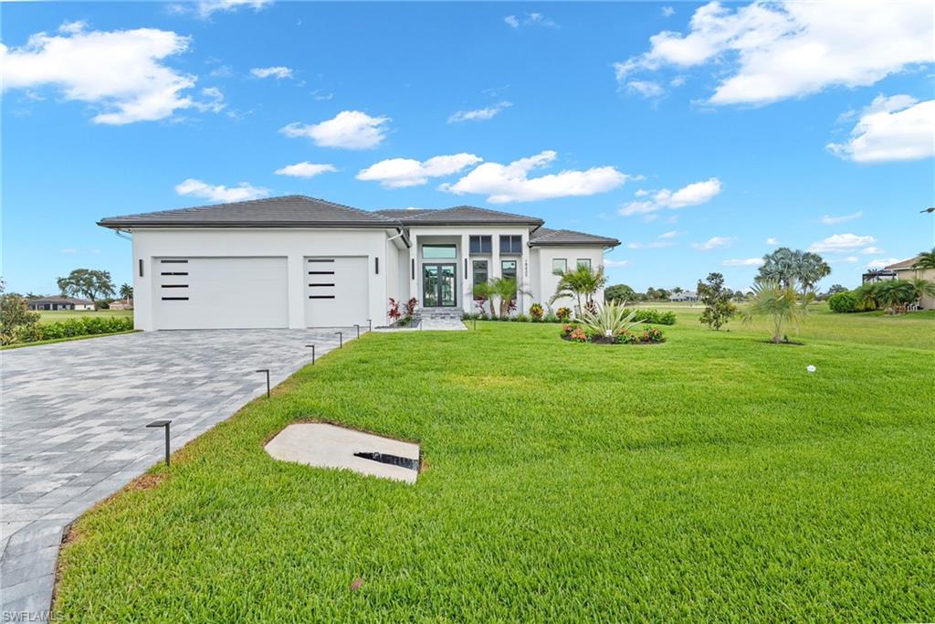 One or more photo(s) has been virtually staged, AI generated or rendered.  Welcome to this extraordinary brand-new custom-built luxury residence offering 4 bedrooms, 3.5 bathrooms, a spacious bonus room ideal for a private office, gym, or media room, and a 3-car garage in a peaceful South Naples golf course setting. Crafted with timeless elegance and uncompromising quality, this exceptional home features soaring ceilings, abundant natural light, designer finishes, and seamless indoor-outdoor living throughout.

From the moment you enter, you are greeted by an abundance of natural light, soaring ceilings, and impeccable attention to detail throughout. The open-concept floor plan features premium-quality materials, and beautifully curated finishes that reflect superior craftsmanship, custom cabinetry, quartz countertops, designer finishes, high-end appliances that elevate every space, impact-resistant windows and doors, smart home features, and expansive living spaces ideal for both entertaining and everyday comfort. Beautiful Italian porcelain flooring flows throughout the main living areas, adding sophistication and timeless style.

The grand primary suite offers a private retreat with generous space and luxurious details, and a spa-inspired atmosphere designed for relaxation, while the open living and entertaining areas are enhanced by a stylish wet bar and seamless connection to the outdoor living space.

Step outside to your private resort-style lanai featuring a sparkling pool and spa, elegant marble pool deck, outdoor kitchen, and tranquil golf course views surrounded by peaceful tropical surroundings — perfect for enjoying the Florida lifestyle year-round.

Located within Royal Palm Golf Estates, a peaceful gated community known for oversized homesites, scenic golf course and lake views, low HOA fees, and tranquil natural surroundings. Residents enjoy optional golf membership and a relaxed luxury lifestyle just minutes from the stunning Gulf Coast beaches, Marco Island, downtown Naples, fine dining, shopping, and more, this home offers both tranquility and convenience in one of Naples’ most desirable areas.

A rare opportunity to own a truly elegant custom luxury home where sophistication meets coastal living. This is more than a home — it is a statement of luxury and lifestyle!