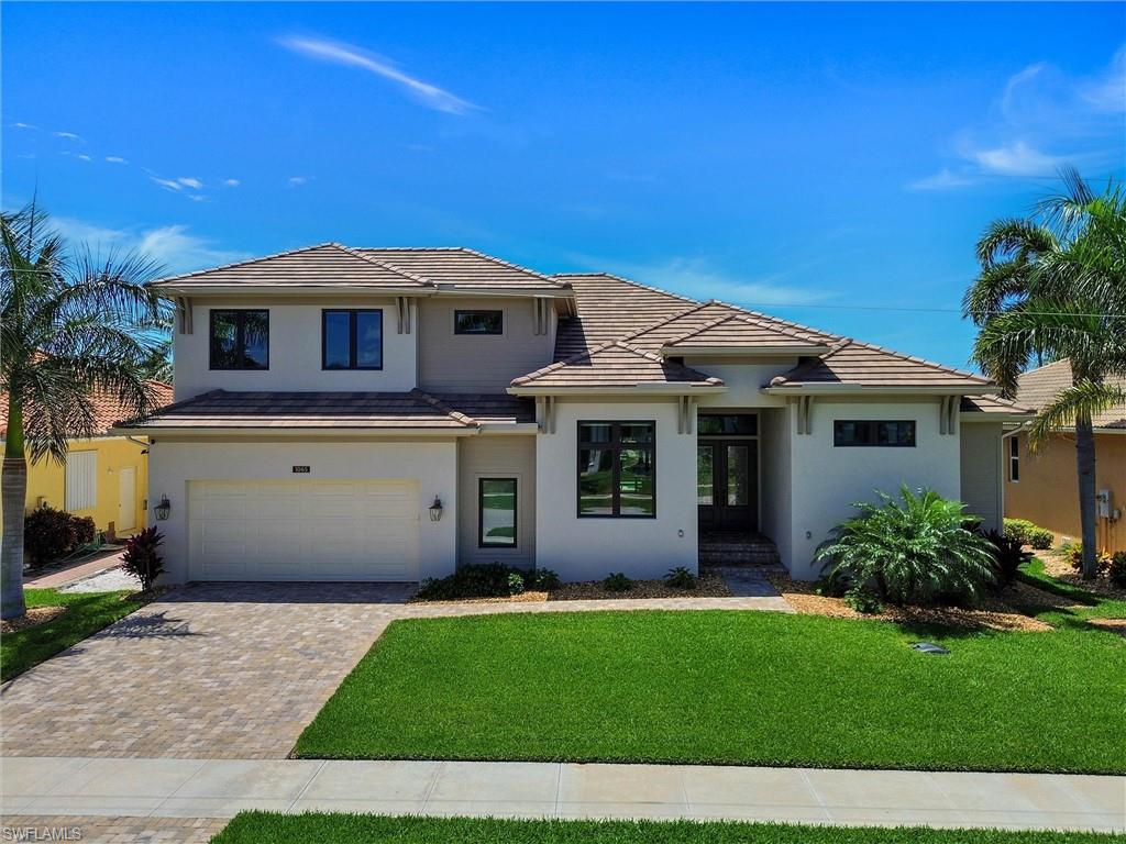 Two years NEW! This Stunning Custom Home is designed for Comfort, Style, and Entertaining
Step through impressive 8-foot doors into a bright, welcoming foyer that opens to a spacious, open-concept living area—perfect for both relaxed everyday living and hosting guests.
The Great Room flows effortlessly to the outdoor lanai and pool/spa through a dramatic 10-foot sliding glass door that fully disappears, blending indoor and outdoor living. Electric shutters enclose the lanai, offering convenience and protection.
Every detail of this home has been thoughtfully designed. The chef’s kitchen features beautiful cherry wood cabinetry with soft-close doors and pull-out shelves, sleek black stainless KitchenAid appliances, including a gas range, and elegant Cambria quartz countertops. Box beam ceilings add architectural charm to both the kitchen and Great Room, while a dining room breakfast bar provides extra storage and serving space. A large pantry and additional first-floor storage ensure everything has its place.  Elegant finishes continue throughout, including solid wood doors with detailed trim, upgraded baseboards, and unique touches such as shiplap ceilings in the foyer and lanai. Even the laundry and powder rooms are finished with the same level of care.
The home offers three spacious en suite bedrooms, each with walk-in closets and Hunter Douglas blinds, along with beautifully designed bathrooms featuring Kohler fixtures and custom tilework. With 8 separate thermostat zones, comfort can be tailored throughout the home.  
Additional highlights include a large dedicated office or flex room, an expansive upstairs storage area, and a well-equipped laundry space. The oversized two-car garage provides room for vehicles and more, with a durable polyaspartic floor, its own split A/C unit, and reinforced walls for easy storage installationEnjoy all-day sunshine on the south-facing pool and lanai, complete with a convenient pool bath. A tankless water heater with recirculating system ensures efficiency and comfort throughout the home.
For added peace of mind, the home is equipped with a 38KW Generac “Quiet Series” generator—keeping you secure during hurricane season.
This exceptional home is designed to impress even the most discerning buyer.