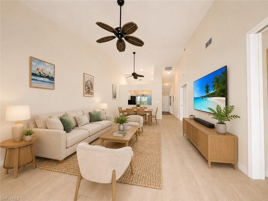 One or more photo(s) has been virtually staged, AI generated or rendered.  Wake up to breathtaking sunrises and panoramic lake views from this beautifully maintained waterfront villa in the highly sought-after Lakeport Villas at Crown Pointe. Situated on one of the largest lakes in Naples, this 3-bedroom, 2-bath residence offers serene water views from the living room, kitchen, lanai, and primary suite, creating the perfect backdrop for everyday Florida living.

Designed for comfort and convenience, the home features new Spanish porcelain tile flooring throughout, adding timeless style and durability. The spacious primary bathroom includes a barrier-free, roll-in shower with a built-in bench, providing enhanced accessibility without sacrificing elegance. A gentle interior ramp from the living area to the enclosed lanai offers added ease of mobility, making the home accommodating for a variety of lifestyles.

Enjoy your morning coffee or evening cocktails from the oversized screened lanai with desirable eastern exposure, overlooking the peaceful lake and shared floating dock. Launch your kayak, cast a fishing line, or simply relax while watching Naples' abundant wildlife, including egrets, herons, ibis, and other shorebirds.

The bright, open floor plan is filled with natural light, while the two-car garage provides ample storage and convenience. Whether you're looking for a full-time residence or a seasonal retreat, this home offers the perfect blend of comfort, accessibility, and waterfront living.

Crown Pointe residents enjoy outstanding amenities, including a lakeside clubhouse, resort-style pool, fitness center, sauna, tennis and pickleball courts, and scenic walking paths. Ideally located just minutes from downtown Naples, you'll be only a short drive from the world-class shopping, dining, and entertainment of Fifth Avenue South and the white sandy beaches of the Gulf.

This is your opportunity to enjoy peaceful lakeside living in one of Naples' best-kept secrets.