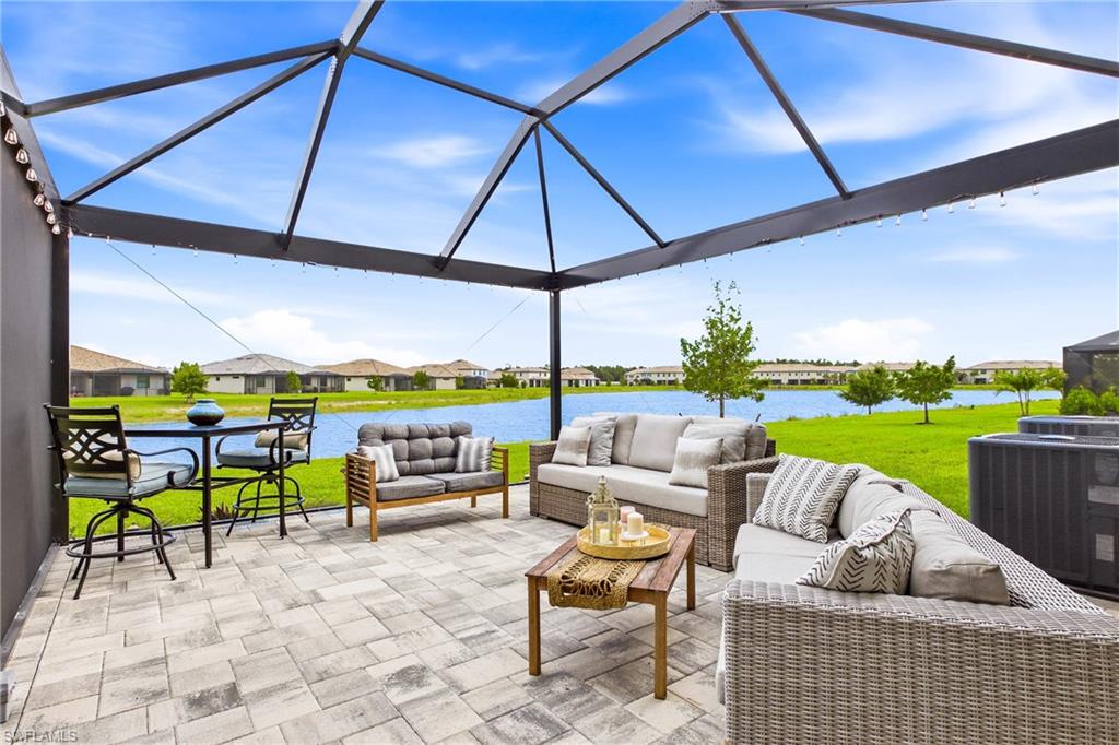 Unique Opportunity!  The only Lakefront End Unit available with a huge extended 24' x 16' screened lanai! That's nearly 400 sq ft of additional outdoor living which makes hosting friends and family easy! Welcome to the most desirable townhome opportunity in the entire community!  This highly sought-after Ava floor plan offers a combination of privacy, outdoor living, and water views that are nearly impossible to find in any other townhome community throughout Southwest Florida! Enjoy exclusive features only available with this model including a private sidewalk entry, enjoying additional windows and natural light in the interior, and having an enhanced layout with kitchen nook, and the added privacy of no neighbors on one side!  Thoughtful design from the 2nd floor laundry, to a large primary suite featuring nook for desk or sitting area optimizes function and versatility.  Townhomes also have an additional storage closet on the lanai, extended driveways, and multiple guest parking lots for guests.  Has all the perks of a vacation resort wrapped into the convenience of a home that feels like a single family without the headache!  Experience maintenance-free living, with building exterior, roof, and landscaping maintained by the association!  At the Clubhouse, it's a vacation every day, where a lifestyle director brings the restaurant bar & grill and resort pools to life with calendarized social events and tons of fun activities! Other amenities include 2 separate gyms, saunas & locker rooms, full court indoor basketball/volleyball court, arcade, social hall, 4 pickleball courts, tennis courts, playground, putting green, event lawn, splash pad, 2 bocce courts, sand volleyball court, a firepit and more! Quick access to I75, airport, Jet Blue Park, and all the daily stops along the Daniels and Colonial Corridors!  With no other lakefront end units currently available and one of the largest screened lanais in the community, opportunities like this are exceptionally rare and truly won't last.
