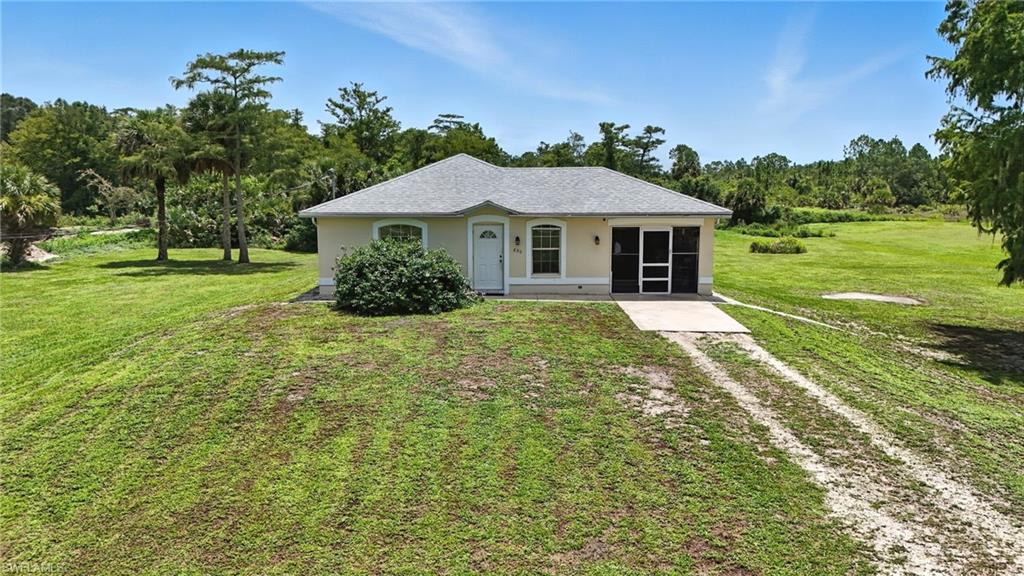 HIGHEST AND BEST DUE FRIDAY, AUGUST 1ST 2025 AT 5PM. Welcome to this 3-bedroom, 2-bathroom home set on 2.73 acres in the desirable Golden Gate Estates. Enjoy the perfect mix of privacy and tranquility with room to build your dream home or invest in your future in this growing neighborhood. The home features neutral paint, an open layout, tile floors throughout, and a functional galley kitchen. The primary bedroom includes an ensuite bathroom, with two more bedrooms and a full guest bath nearby. There’s also an attached garage and plenty of room for storage. Bring your ideas and make it your own. Located just minutes from Publix, gas stations, hospitals, and shopping—this property offers a peaceful setting with easy access to everyday essentials. Come take a look!