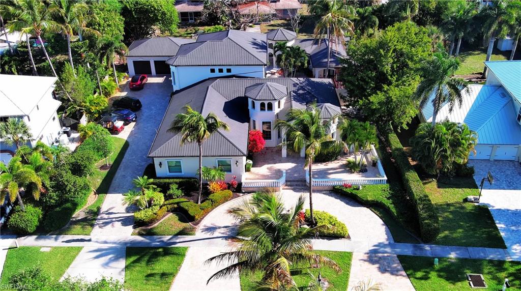 Welcome to an extraordinary custom-built Mediterranean estate in the heart of Fort Myers, just one block from the Caloosahatchee River and ideally situated off the iconic McGregor Boulevard. This private tropical oasis offers over 6,000 square feet of air-conditioned living space—including a separate ground-level guest suite—and more than 12,600 total square feet of exceptional indoor and outdoor living.
Meticulously maintained and continuously updated, this residence showcases superior craftsmanship with soaring ceiling heights from 10 to 22 feet, highlighted by custom coffered and tray ceilings throughout and enhanced by elegant indirect lighting and beautifully appointed fixtures. Travertine flooring and rich hardwood floors create a seamless blend of warmth and sophistication.
The gourmet kitchen is designed to impress, featuring a Sub-Zero refrigerator, walk-in pantries, wine cooler, and a dedicated bourbon room—perfect for entertaining. A charming reading nook adds character, while expansive living spaces flow effortlessly into a media room and multiple en-suite guest accommodations. The home offers six bedrooms and six bathrooms, including two luxurious primary suites.
Step outside into your own resort-style retreat. The custom heated pool is a true work of art, featuring cascading rock waterfalls, a sun ledge, and exquisite marble inlays commissioned from an Australian artist. Surrounded by lush landscaping and complete privacy, the courtyard creates a serene and secluded setting. Motorized screened lanais allow for year-round enjoyment while keeping insects at bay.
Additional highlights include:
    •    Detached 3-car garage with over 1,000 sq ft air-conditioned space
    •    Separate ground-level guest suite for privacy and flexibility
    •    Hurricane-impact, energy-efficient glass throughout
    •    State-of-the-art security camera system
    •    Outdoor kitchen and grilling area
    •    Pergola with hammock and multiple covered patios and decks
    •    Over 1,000 sq ft front porch living space
    •    RV parking with hookup + Tesla charging station
    •    Hunter Douglas shades and plantation shutters throughout
    •    Spa-inspired primary bath with multiple shower heads and body sprayers
This one-of-a-kind estate offers the perfect combination of luxury, privacy, and functionality in one of Fort Myers’ most sought-after locations. Furnishings are negotiable, providing a rare turnkey opportunity.
Experience elevated coastal living in a private tropical sanctuary just moments from the river.
