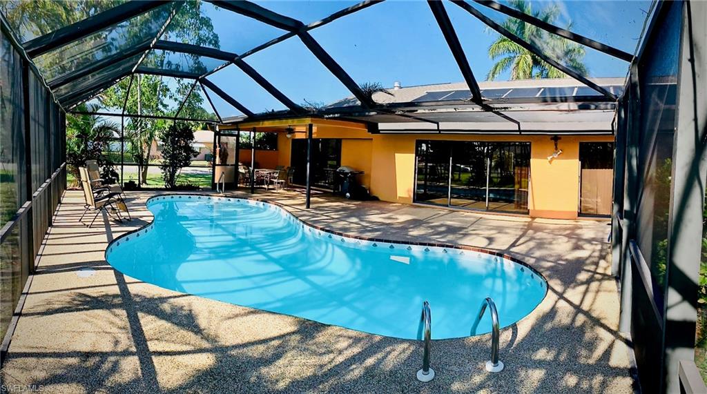 VILLA CORAL SUNBURST is a large modern home in a quiet neighborhood (vacation rental - 7 days minimum - no annual rentals). Villa Coral Sunburst has recently been completely remodeled. Close to shopping, dining, and both bridges. Walk into the generous entry area to a view of the pool and the large living area with cathedral ceiling and wet bar. The connected mirrored dining area has the lanai/pool on one side and the beautiful kitchen with maple cabinets on the other. Step into the oversized lanai and pool area (solar heating). The villa additionally features a spa. The villa comfortably sleeps 6 adults in 3 bedrooms.