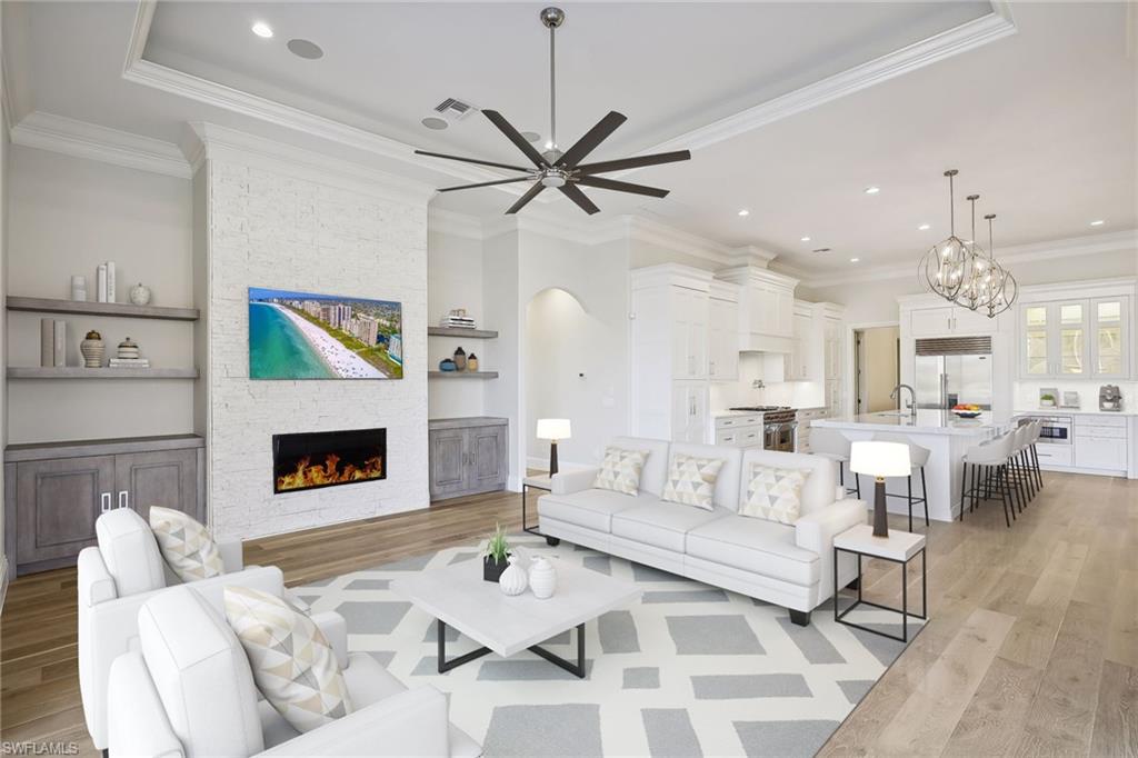 This EXTENSIVELY RENOVATED waterfront estate home, now available at a price BELOW ITS APPRAISED VALUE following a substantial REDUCTION, offers an opulent living experience. With 3 bedrooms plus a den/office & 4 baths, it boasts a brand-new roof & contemporary upgrades. The open-concept floor plan reveals a deluxe chef's kitchen, new high-end appliances & inviting interiors for entertaining. Vaulted ceilings amplify the grandeur of the living/dining area, adorned with a modern fireplace that opens to the lanai. Brand new wood floors add warmth and elegance to the living spaces, creating a seamless flow throughout.

Step outside to discover your private oasis with lake views, a new picture window lanai, and a modern new pool. Additionally, you can install a private boat dock behind your home, offering ease of access to your boat and to explore the expansive 700 acres of freshwater lakes.

Nestled in the exclusive Miromar Lakes neighborhood, this residence is steps away from Beach Club amenities. Miromar offers more than just a residence; it promises an extraordinary resort lifestyle. Seize this value! Act now to own this contemporary haven & embrace waterfront living in style.