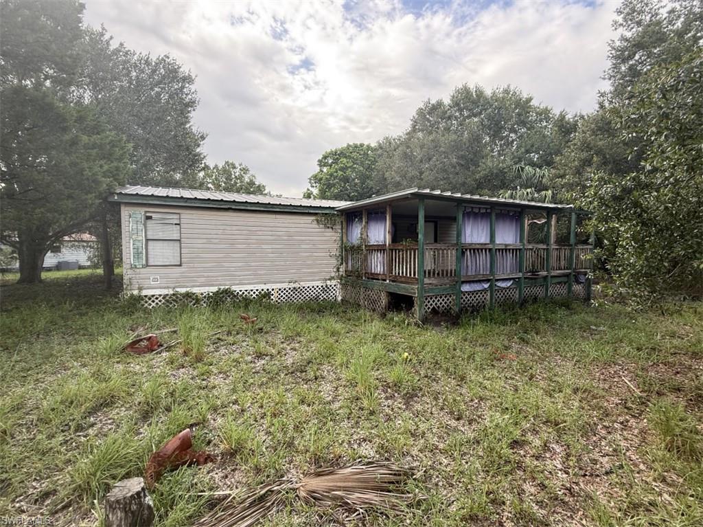 Spacious 4BR/2BA double-wide manufactured home on a 0.31-acre lot in Labelle! Features 1,296 sq. ft., a functional layout, roof under 20 years old, and a 5-year-old HVAC system. Needs cosmetic updates and some repairs, offering excellent value.