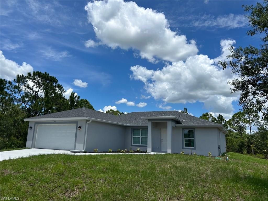 Brand new 3/2 + DEN, 2 CAR Garage. A beautiful open layout with: QUARTZ countertops, Upgraded tile throughout except for carpeted den & bedrooms, FRAMELESS glass shower & Dual Vanity in Master bathroom, Epoxy Garage Floor, Under-Truss SCREENED lanai, Window Blinds (including slider), Tile Shower walls with tub combo in guest bathroom (no plastic inserts) & Higher Baseboards throughout. FULL Appliance Package includes: Stainless Steele Side x Side Refrigerator, Flat top stove, Microwave, Dishwasher and full size white Washer & Dryer. Water Softener. Home also comes with a 2-10 warranty. Pictures are of the same model but different home.