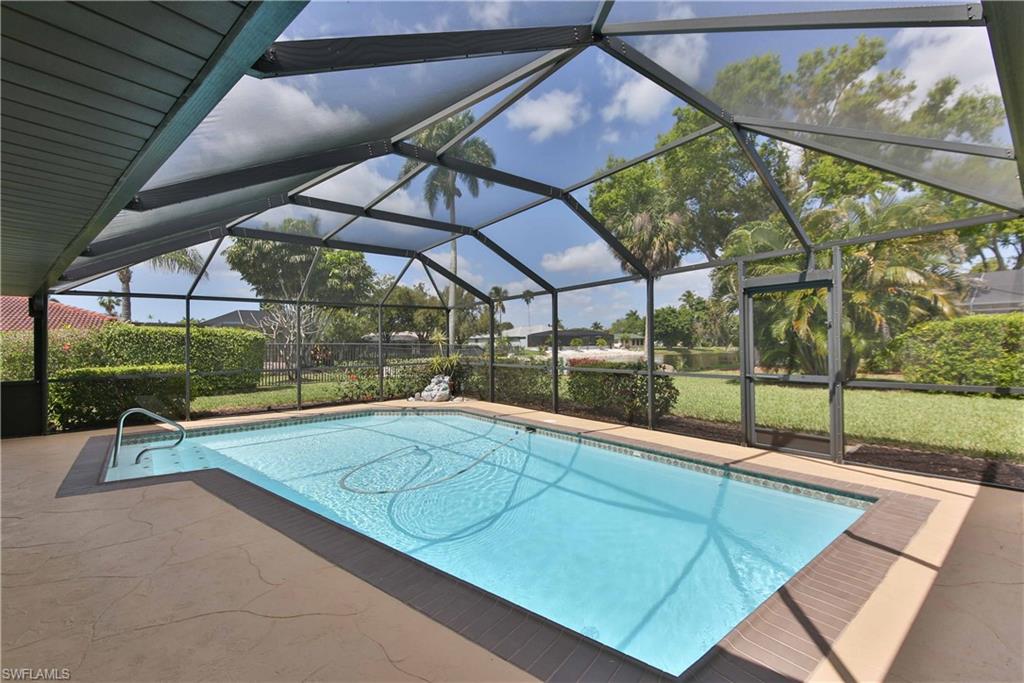 Wonderful lakefront opportunity in the highly desirable Iona corridor. This  3 bed, 2 bath, pool home has been meticulously maintained inside and out. This home offers plenty of extra storage. All 3 bedrooms have extra large walk in closets. The garage is extra wide and extra deep. Updated bathrooms. Newer stainless steel appliances in kitchen. Vaulted ceiling in great room. Two separate living areas. Gorgeous stamped concrete driveway and sidewalk. Irrigation on well. Beautifully landscaped large corner lot with a stunning lake view from your pool/lanai area. Call today for a private tour and see what all this gorgeous home has to offer!
