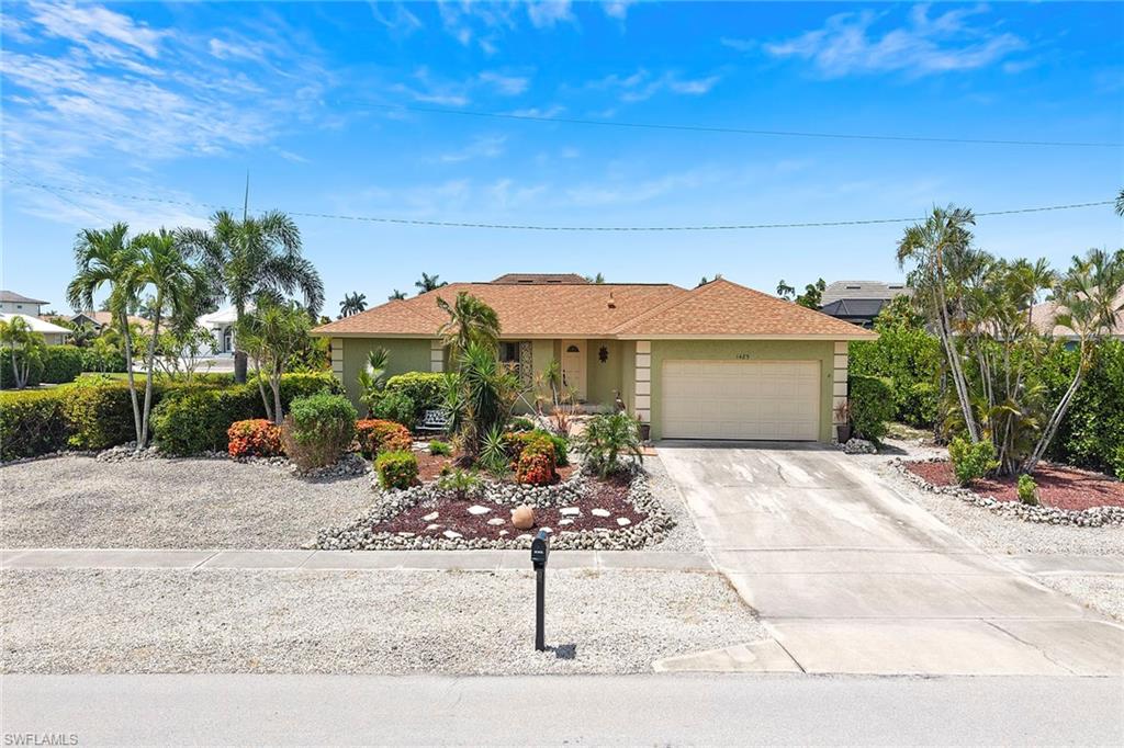 Location, location, this three-bedroom, two-bath home is centrally on Marco Island. Only one block to Mackle Park and a few more blocks to the recreational tennis and pickleball center, YMCA, Tommie Barfield Elementary and Charter Middle School. This home is on a larger corner lot, and has a southern exposure lanai and pool. Newer stainless steel appliances in kitchen. The roof and pool cage were replaced in July 2018. If you want to be on beautiful Marco Island, this home is for you. The flood insurance policy is transferable to a new buyer.