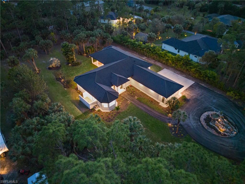 MOTIVATED SELLER!  This timelessly designed estate home, conveniently situated west of 951, conveys modern
sophistication with nature’s beauty as the backdrop.  The 12-14 foot ceilings throughout the home, and park-like landscaping as seen through 10 foot pocketing glass sliders, create the tranquil ambiance perfect for entertaining or relaxing with loved ones. This one-of-a-kind home is further showcased by cypress tongue-in-groove ceilings, meticulous custom carpentry, outdoor shower, and a total footprint of over 6400 square feet under roof.
The new kitchen appliances add contemporary convenience and a summer kitchen enhance the
entertainment experience. The residence boasts a 4th bedroom guest suite with a separate entrance, offering privacy and convenience. Features such as a whole house vacuum, newer roof, and icynene insulation ensure modern comfort and efficiency. Nestled in an A+ school district, this property is centrally located on expansive acreage yet is just minutes away from shopping, beaches, entertainment, and hospital facilities.
The attention to detail and precision with design and construction can be seen throughout, making it easy to fall in love with this impressive home.