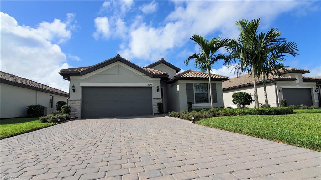 Live the luxury Southwest Florida lifestyle at The Place at Corkscrew! Why wait when you don't have to. Stunning like new Summerwood model by PULTE, with 3 bedrooms plus a den…with pool!!The kitchen features quartz countertops and large center-island that overlooks a spacious gathering room with zero corner sliding doors bringing the outdoor living space in. Perfect for entertaining guests or spending time with family. The amenities at The Place include a two-story, state-of-the-art fitness center, tennis courts with ball machine court, pickleball courts, racquet sports clubhouse and pro on duty, sports courts, bocce, covered playground, dog park, resort-style pool with 100’ water slide and lifeguards on duty, oversized community hot tub and a water splash area. Two amenity buildings house an indoor/outdoor restaurant, Bourbon Bar, Cafe Marketplace, movement room, child care, and massage/spa services, plus two 24-hour manned guard gates. LOW FEES, including professional lawn care and irrigation. Shopping and dining are just a short drive to Miromar Outlets or Coconut Point.