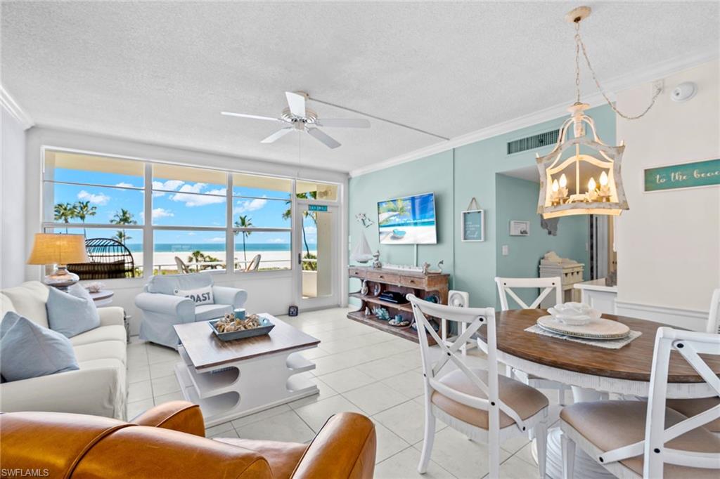 Welcome to Sunset House #412, where every evening ends with a front-row seat to the Gulf. From the moment you step inside, the western exposure draws your eye straight to the water, filling the coastal-styled living space with warm afternoon light and framing views that never get old.
The unit has been thoughtfully appointed with no detail overlooked such as sun-out electric blinds on the high-impact living room windows, a custom mirrored barn door revealing additional storage, and stylish furnishings throughout that capture the ease of island living. The bedroom features beautiful hardwood floors, a generous walk-in closet, and a large impact window dressed with plantation shutters that frame a perfect beach view. The kitchen was updated in 2021 with new stainless steel appliances and offers efficient, well-organized space for everything from morning coffee to entertaining.
What sets this residence apart is the rare combination of true beachfront living with a turnkey, move-in ready package, including a designated covered carport, additional storage on the same floor, and a rental history for those seeking an income-producing retreat.
Sunset House amenities elevate the experience further, with a heated pool steps from the sand, a private boardwalk to the beach, barbecue area, social room with kitchen and library, and dedicated beach chair and bike storage. Your Marco Island paradise awaits.