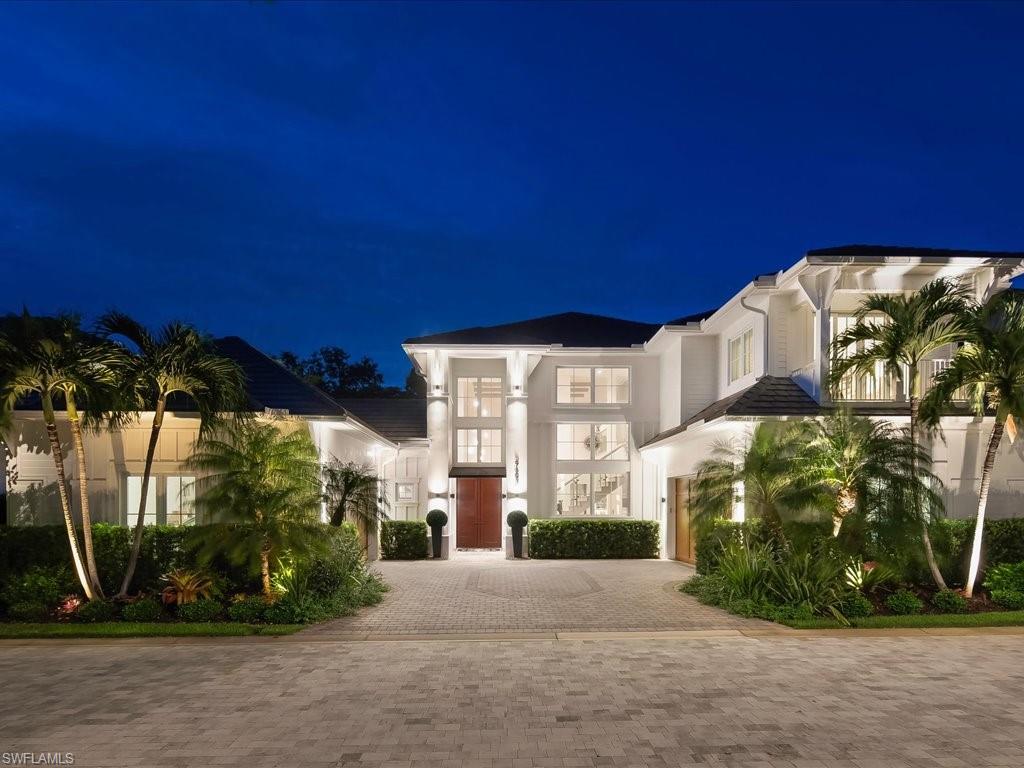 At the intersection of privacy, prestige, and unparalleled walkability, Casa Mar at 9193 Mercato Way presents a lifestyle opportunity found nowhere else in Naples. Situated on a rare double lot within The Residences at Mercato, an intimate gated enclave of only forty-five residences framed by charming brick-paver streets, this exceptional home offers a level of space and exclusivity seldom available. One of only four residences built with this distinctive floor plan, Casa Mar welcomes guests through a dramatic two-story foyer that opens to an equally impressive great room, where soaring ceilings and abundant natural light create an atmosphere of refined elegance. Professionally decorated, the residence encompasses four bedrooms, a den, three-and-one-half baths, a spacious loft with dedicated office space, and a four-car double garage. Designed for seamless indoor-outdoor living, multiple patio areas surround a private saltwater pool, outdoor kitchen and barbecue area, pet-friendly backyard, and private sauna enhanced by a Blaupunkt music system. Every detail has been thoughtfully curated to deliver comfort, sophistication, and effortless entertaining. What truly distinguishes Casa Mar is its extraordinary lifestyle positioning. Quietly tucked behind private walls, yet only moments from Naples’ renowned white-sand beaches and championship golf, residents enjoy the rare luxury of leaving the car behind. Within a short stroll, Mercato offers an unmatched collection of fine dining, boutiques, cafés, fitness and wellness studios, nightlife, live music venues, a luxury cinema, Whole Foods, and approximately sixteen to twenty restaurants within one mile. The newly unveiled Piazza further enriches the experience with concerts, outdoor films, seasonal events, and cultural programming. Perfectly positioned between the Ritz-Carlton Beach Resort and the Ritz-Carlton Golf Resort, Casa Mar delivers a distinctive blend of elegance, convenience, and vibrant Naples living. This is more than a residence—it is a lifestyle reserved for those who value having everything within reach while enjoying the privacy of an exceptional home.