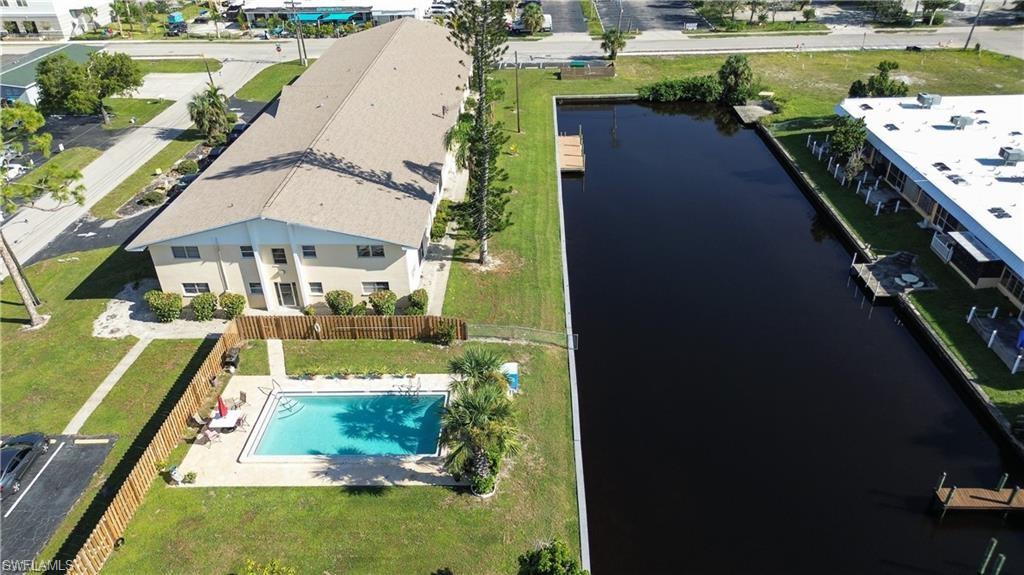 SECURITY – PRIVACY - FURNISHED 2 Bedroom Gulf Access waterfront condo with Boat Docking included in the heart of Cape Coral walking distance to Bimini Basin at Coronado Blvd with quick access to tremendous shopping, banks, restaurants, and entertainment! This roomy condo provides a canal view from the living room or the screened porch to watch the sun rise. Open modern kitchen. Private swimming in the gorgeous community pool while listening to the birds and watching the squirrels play. The building is in the process of being renovated so don't judge the book by the cover. New furniture coming for the lobby socialization area. New tile flooring throughout the building. Come inside to be pleasantly surprised. By the way, you cannot get inside without a security key to the main entrance of the building. This is not an apartment building whereas anyone can be running up and down your hallways... it is a condo building with security doors. Come home and relax.