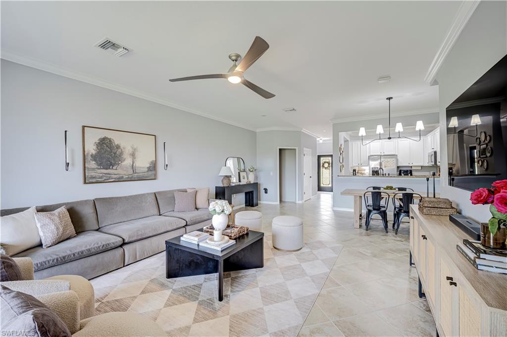 One or more photo(s) has been virtually staged, AI generated or rendered.  Welcome to 2620 Blossom Way, a beautifully maintained townhome located in the sought-after gated community of Orange Blossom Ranch in Naples. This spacious residence offers a desirable open-concept layout with 3 bedrooms, 2.5 bathrooms, and a comfortable blend of modern finishes and everyday functionality.

The main level features a bright and inviting living area, a well-appointed kitchen with stainless steel appliances, ample cabinetry, pantry storage, and a breakfast bar perfect for casual dining or entertaining. Upstairs, the spacious primary suite offers a private retreat with an en-suite bathroom and generous closet space, while two additional bedrooms provide flexibility for guests, a home office, or family needs.

Enjoy the Florida lifestyle from the screened lanai overlooking a peaceful lake view, the perfect setting for morning coffee or relaxing evenings. Additional features include an attached garage, convenient upstairs laundry, and thoughtful upgrades throughout.

Orange Blossom Ranch offers an exceptional resort-style lifestyle with amenities including a clubhouse, fitness center, resort-style pools, spa, sports courts, playgrounds, splash pad, and scenic walking areas. Ideally located near shopping, dining, schools, and major roadways, this home places you in the heart of one of Naples’ fastest-growing areas. With continued development, new businesses, retail, and dining options expanding throughout the surrounding area, this community offers not only a comfortable lifestyle today but also exciting opportunities for future growth and convenience.

Don’t miss the opportunity to own a home in a thriving Naples community where modern living meets long-term value.