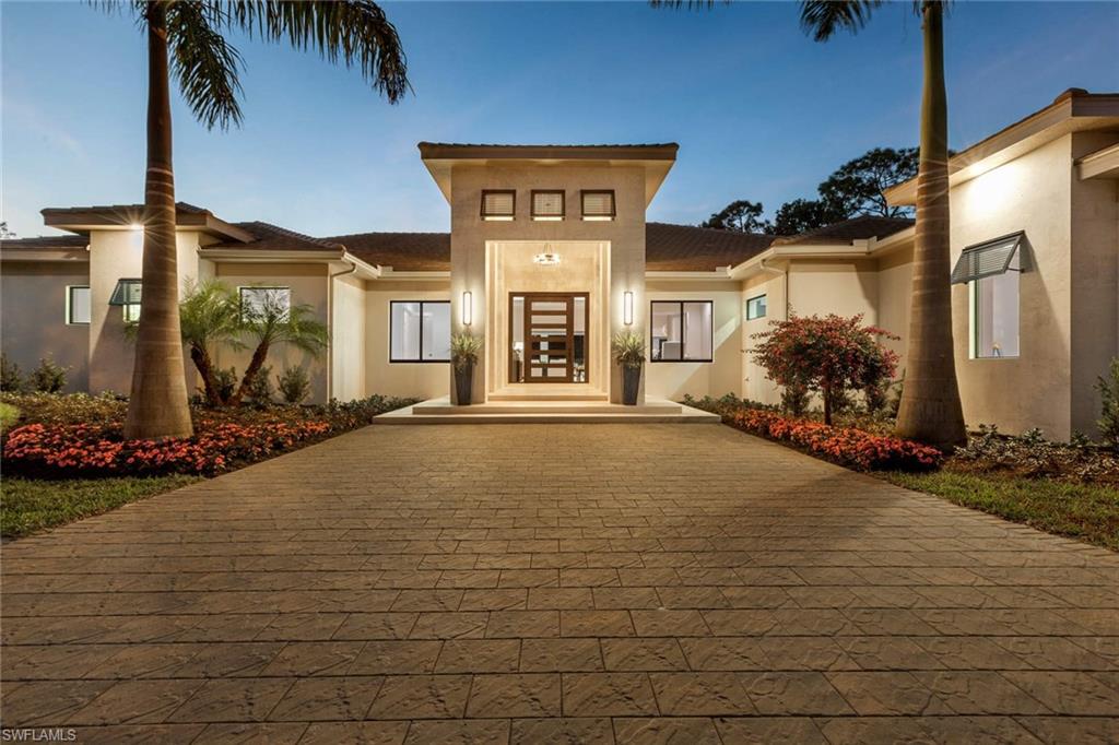 This exceptional custom-built estate home, finished in December 2019, is located in Pine Ridge on 1.21 acres. A western exposure and custom finishes by a meticulous builder, who created distinctive architectural features, make this home a must-see. Special features of this 4643 SF home include over 3,000 SF of outdoor entertaining space, a 40’x20’ open-air pool and spa, gourmet kitchen and a butler pantry, 1,000-gallon propane tank that serves stove, fireplace, grill & more. At an elevation of 18 feet 4 inches it is well out of the flood zone and new construction means current hurricane standards are met. This home has the luxury of being on city water and is set back from the road with 4 concealed side load garages giving it a special estate home feel. Top-quality throughout in a neighborhood rated in 2018 as one of the best in the USA. If that is not enough the outdoor elevated dog washing station will win you over.  Located close to Waterside Shops, Artis-Naples, beaches & more. Click virtual tour link or contact the listing agent to see a 3D virtual tour with a dollhouse view.