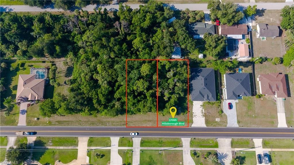 PRIME PORT CHARLOTTE LOCATION  SINGLE OR DOUBLE LOT INVESTMENT OPTION! Build your Florida dream home on this premium 0.23 acre residential lot (10,000+ sq. ft.) situated on paved Hillsborough Boulevard. Located in a rapidly growing, established neighborhood surrounded by beautiful contemporary homes, this lot features electricity, cable, and phone lines readily available at the street. With NO HOA fees or building timeframes, you have total freedom to bring your own builder and construct whenever you are ready!

PACKAGE DEAL: The adjacent lot (17073 Hillsborough Blvd) is also available! Purchase both parcels together to secure a massive 0.46-acre double lot boasting 160 feet of prime road frontage. The seller is motivated and ready to structure a  package deal for a combined purchase. Enjoy an exceptional location with seamless access to world-class golfing, pristine beaches, shopping, dining, and I-75. Don’t miss out on doubling your footprint—bring your offer today!