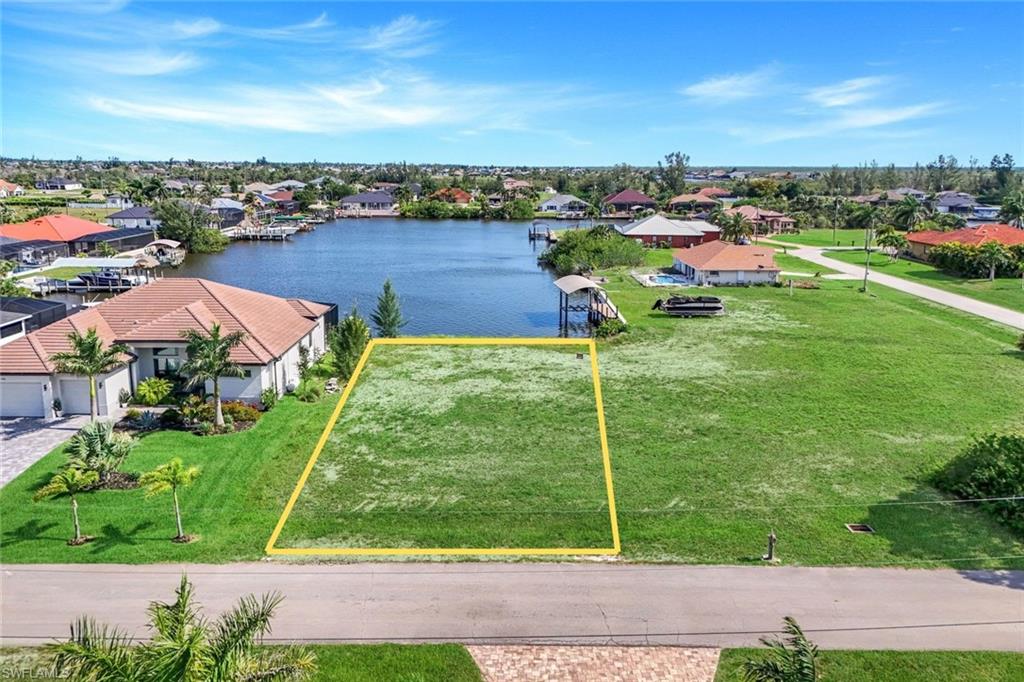 Gulf access, southern exposure, and wide canal views make this Northwest Cape Coral homesite an outstanding place to build. With a newer seawall already in place, you have a head start to building your new home. The property provides excellent potential for a beautiful residence with outdoor living and lanai space designed to capture the beautiful water views, natural light, and year-round Florida sunshine. Located near the highly anticipated Seven Islands development, this area continues to draw attention as one of Cape Coral’s most exciting future waterfront destinations, with plans centered around boating, dining, recreation, and coastal lifestyle amenities. The property is also close to the brand-new Tropicana Park, adding even more convenience and outdoor enjoyment nearby. From morning boat rides to sunset cruises, this location offers easy access to some of Southwest Florida’s most loved waterfront destinations, including Matlacha, Pine Island, Cayo Costa, Captiva, and more!  PID 36-43-22-C2-05251.0070.