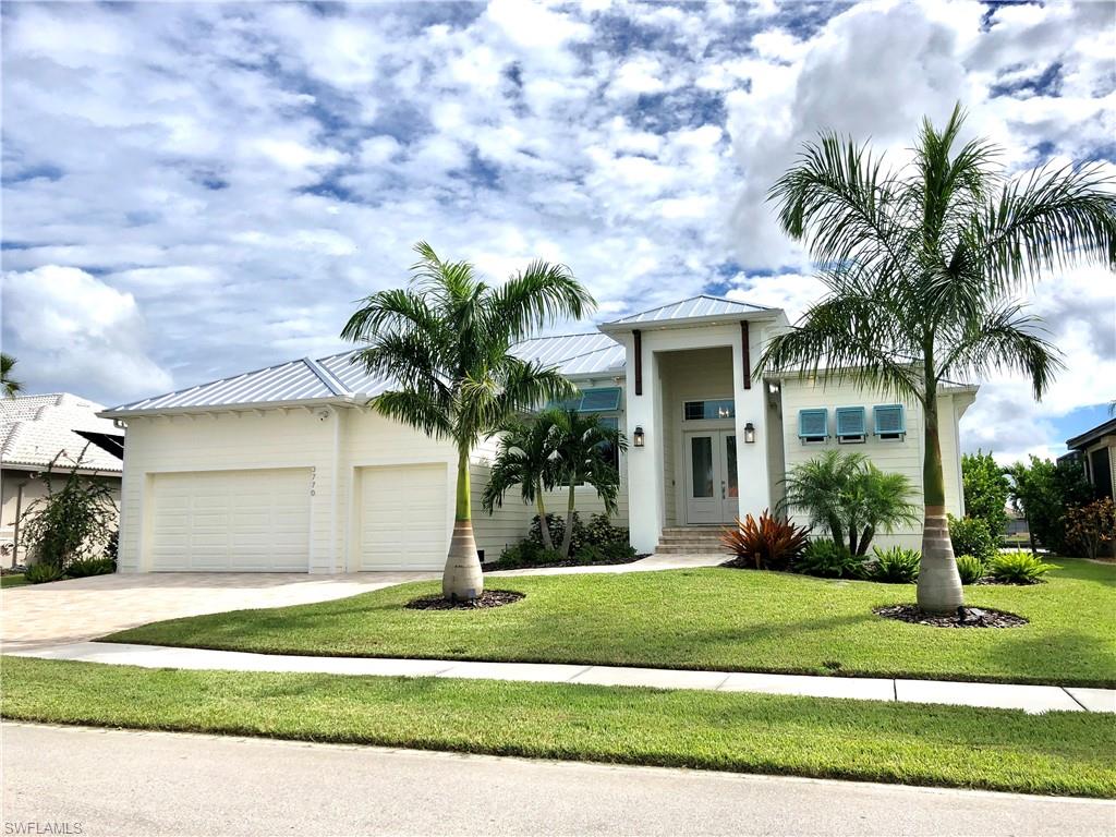 Paradise abounds you from the moment you enter this custom built Key West Style Gulf Access Waterfront home.  This dream home is located on a Sailboat Gulf Access Canal with intersecting Basin views in the sought after community of Punta Gorda Isles.  Just a 10 minute boat ride from the time you lower the 10,000 pound boat lift off the expansive concrete dock out to the pristine waters of the Gulf of Mexico.
This one time owner spared no expense w/ finest finishes in this Custom built home in 2019.
Home features heated pool and champagne spa, impact glass, roll down shutters, whole house generator, 500 gallon propane tank. Porcelain plank flooring throughout, volume ceilings, solid core 8 foot doors, coferred ceilings w/crown molding, 3 car garage & driveway, 3 beds, 3 full baths w/walk in showers, Formal Dining room, Study/Den and Great Room with 90% sliders that pocket for unobstructed views.  Gourmet kitchen w/solid wood cabinets and stacked glass cabinets. Quartz Counter Top’s in kitchen and throughout the house. Huge center island w/sink and built in beverage cooler.  Gas stove top with vented Hood, built in oven. 

Make Paradise a Reality not Just a Dream!!!