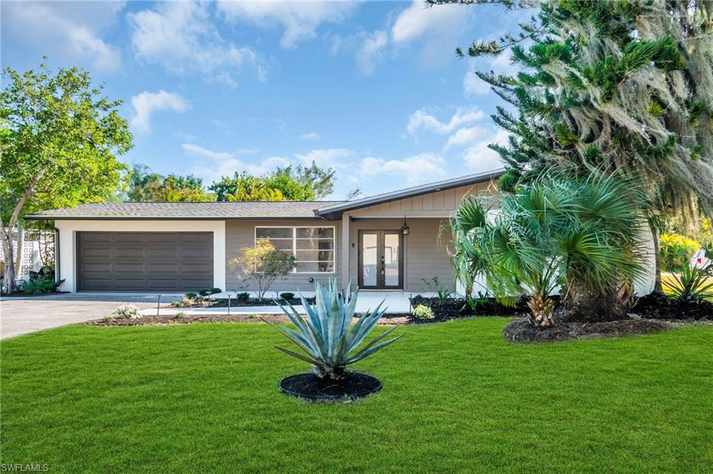 Welcome to 2114 Davis Blvd. This move in ready home features a spacious open concept layout with 4 bedrooms 2 baths. Porcelian tile flooring, 5" Baseboards, designer 2 tone solid wood cabinets with Brand new LG appliances. Roof 2023. New Upgrades includes AC Unit, Water Heater, Hurricane Impact doors, Window Blinds, soffit, Gutters and many more providing peace of mind for years to come.The bathrooms showcase elegant floating vanities and upscale finishes. Situated on a corner lot with low voltage lighting, this property offers ample space for Boat/RV parking and no HOA restrictions. Conveniently located near shopping, dining, major highways, and a nearby Gulf-Access boat ramp, this home perfectly blends comfort, style and the Southwest Florida lifestyle.