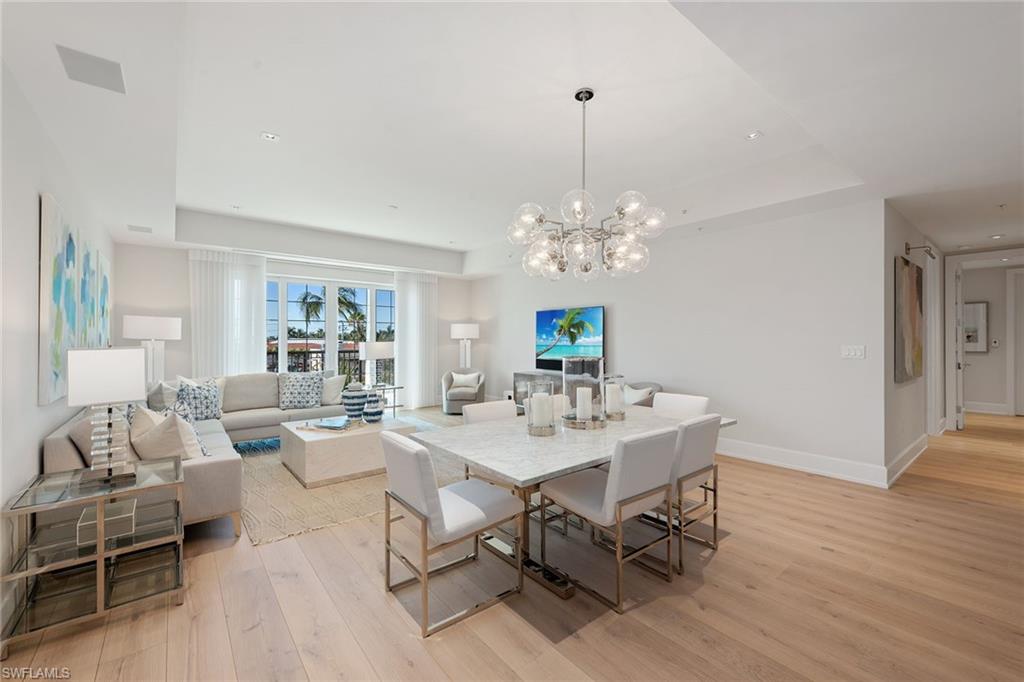Rarely available, The Residences at 5th and 5th is the epitome of Old Naples luxury living. This exceptional third-floor furnished residence in the heart of Fifth Avenue South features a modern design aesthetic. A contemporary foyer leads to a grand living space ideally suited for optimal entertaining with a seamless flow from the open plan kitchen and great room that extends to a private balcony. A streamlined kitchen features custom cabinetry and top-of-the-line appliances, while the master retreat leaves nothing to be desired, with an oversized walk-in closet, free-standing soaking tub, large walk-in shower, dual vanities and private balcony. Two additional light-filled guest bedrooms, each with an en-suite, provide ample space for star gazing and relaxation. Owners within The Residences at 5th and 5th enjoy breathtaking panoramic views from the exceptional rooftop pool and spa, complete with a multilevel sundeck, outdoor grilling area, dining terrace and gas fire pit. A private fitness center, two underground parking spaces, dedicated storage and a state-of-the-art security system complete the offering within this distinctive building.
