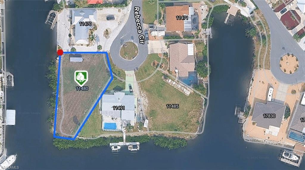 PERMIT READY –ENJOY THE BEAUTIFUL RENDERING PLANNED FOR THIS SINGLE-FAMILY LOT. A rare opportunity to build immediately with an approved single-family home permit already in place—no waiting to break ground. Preliminary cost estimates are available. Located in a spectacular setting ideal for boating enthusiasts who prefer peaceful waters without the congestion of river boat traffic. Enjoy a quick 10-minute boat ride to Fort Myers Beach, where you can dock and shop at Publix, or bike to the beach in minutes. The community entrance is perfectly positioned before the main beach traffic, offering convenience without the congestion. Walmart and several popular restaurants are within walking distance. This homesite features southwestern exposure, providing stunning sunset views year-round. The approved site plan also includes space to park an RV or boat trailer beside the home, which is permitted by the community. A true gem offering location, lifestyle, and immediate buildability. Small boat ramp. This listing contains some virtually rendered photos.