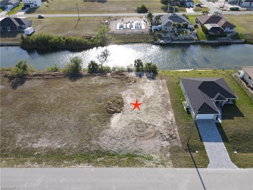 **Rare 0.34-Acre Triple Lot on Freshwater ** – Build Your Dream Home or Invest for the Future!** Opportunities like this don't come along often. This oversized triple lot offers exceptional space and flexibility, providing the perfect setting to build your custom dream home with room for expansive outdoor living, a pool, additional garage space, or simply the privacy that comes with a larger homesite. Situated on a peaceful freshwater canal, you'll enjoy a tranquil waterfront setting while remaining just minutes from Pine Island Road with convenient access to shopping, dining, entertainment, and schools. Whether you're ready to build now or invest in the future, this prime property is an outstanding opportunity in one of Cape Coral's growing and desirable areas.