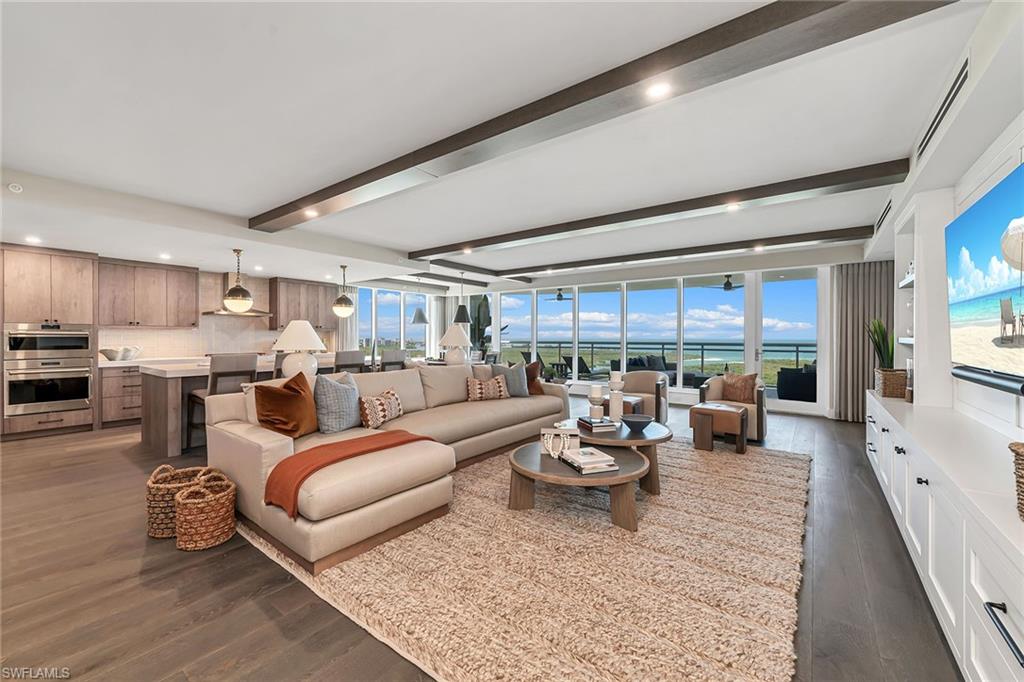 Live the serenity and understated elegance of Kalea Bay: A Naples 5-star, luxury-designed, pet-friendly waterfront resort community. Opportunity awaits with this rare tower-200, 22nd-floor end unit offering endless unobstructed Gulf and bay views. Private elevator foyer opens to award-winning interiors designed by Renee Gaddis Interiors. Experience an open and elegant floor plan that spaciously flows from room to room, featuring floor-to-ceiling impact-resistant glass windows/doors and 2 open lanais with glass railings framing breathtaking sunrise and sunset vistas. Custom upgrade and interior design package includes Wolf and Sub-Zero appliances, wine bar, natural gas, Legno Bastone wood floors, smart home (TV, lighting and electric blinds) custom built-in cabinetry and closets, designer ceiling/wall treatments and draperies, quartz countertops and much more. Don’t miss this rare opportunity to experience the rooftop pool and sky lounge, indoor/outdoor bistro, restaurants and bars, state-of-the-art fitness centers, tennis/pickleball, 3 pools (children, lap, adult), 12 guest suites, plus 2 coveted deeded garage spaces, all within the privacy and luxury of your own designer home.