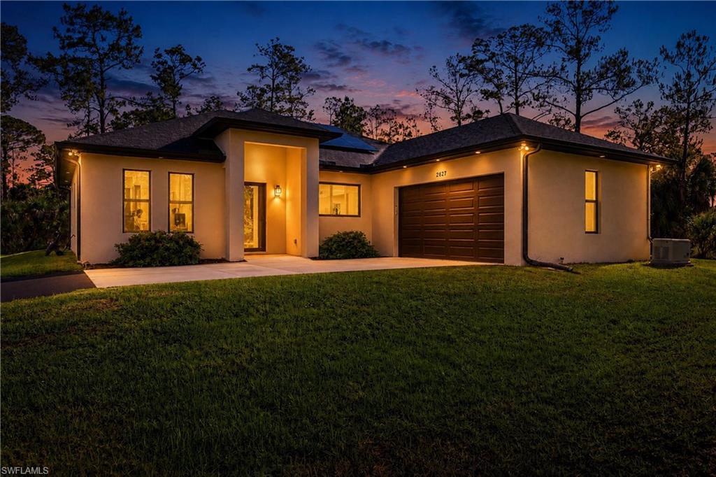 Built in 2021, this custom-built pool home offers quality construction, thoughtful design, and upgrades rarely found in a typical spec home. Nestled among the trees, the property provides privacy and plenty of space to enjoy the Florida lifestyle. Highlights include a saltwater pool and spa added approximately two years ago, a whole-house generator connected to a 500-gallon propane tank, and a solar system installed about two years ago.

The upgraded kitchen is the heart of the home, featuring a large 6' x 6' island with dual deep stainless steel sinks, fingerprint-resistant stainless steel appliances, range hood, wine cooler, 42-inch solid wood cabinets, Bianco Romano granite countertops, and porcelain tile flooring throughout the main living areas.

The spacious primary suite includes a large walk-in shower, thermal steam sauna, rain shower, dual sinks, granite countertops, and solid wood cabinetry. The guest bathroom is equally impressive with a spa-style shower, granite countertops, solid wood cabinetry, and a glass enclosure. Both bathrooms offer a spa-like feel with quality finishes and thoughtful design.

Designed with accessibility in mind, the home features extra-wide doorways and oversized bathrooms. Additional upgrades include impact-resistant windows and doors with thermal tint and UV protection, insulated interior and exterior walls for added sound reduction and energy efficiency, an under-sink reverse osmosis water system, oversized 3.5-ton 16 SEER A/C system, central vacuum, security cameras, LED motion lighting, automatic irrigation system, fireplace, and a subpanel ready for future projects.

The property offers plenty of room for RVs, boats, horses, livestock, or even a future guest house.

Conveniently located approximately 20 to 30 minutes from Naples beaches, downtown dining, shopping, and entertainment.