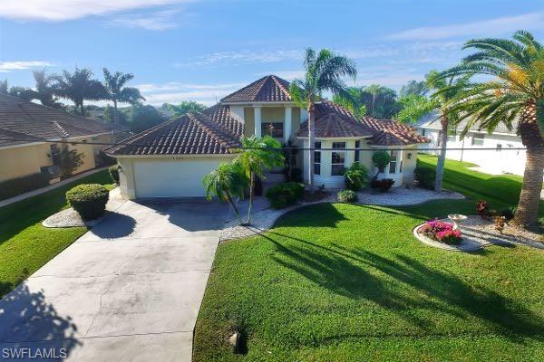 PRICE REDUCTION! Elegant, Turnkey 3 bedrooms, 2.5 bathrooms single family home in super convenient location for the boater and shopper. Sailboat access, no bridges, quick, direct access to Gulf of Mexico. Walking distance to Walgreens, Publix, Mc Donalds, Banks and other stores. 
Southern rear exposure with rectangular, electric heated pool, big pool deck, large covered lanai and screened-in pool cage. Concrete dock with electricity and water at the captains walk, 10000 pound boat lift and 25000 pound boat lift.
Great open floor plan with huge living room, high ceilings, spacious rooms, great kitchen with lots of counter space and cabinets, red barrel tiled roof, tropical landscaping and raised entry. Easy to show.
