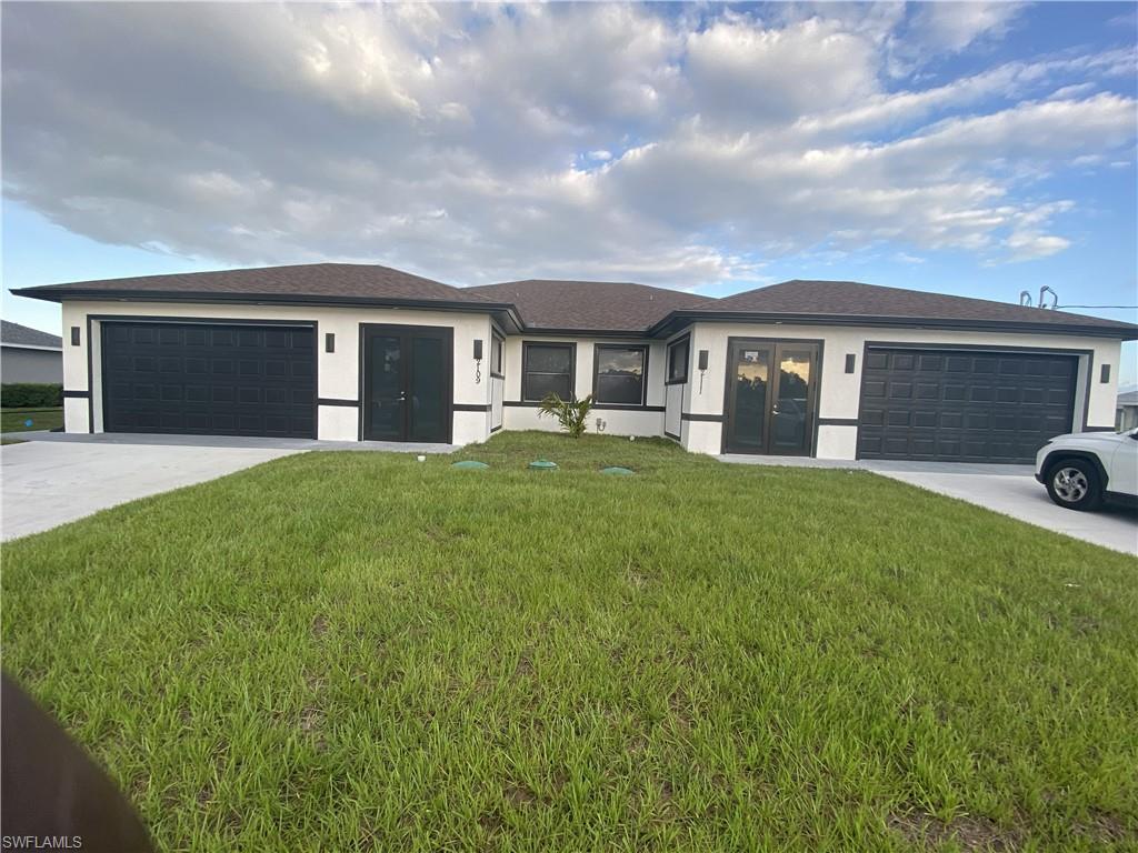 Experience luxury living in this stunning. brand-new duplex located in the heart of Lehigh Acres. Featuring elegant impact double front doors, a welcoming front patio, and a spacious screened lanai perfect for relaxing or entertaining. The open-concept floor plan offers modern comfort and style, highlighted by a breathtaking waterfall island kitchen with upgraded quartz countertops and luxury finishes throughout. Each primary bathroom includes his-and-her sinks, creating a spa-like retreat. Both units offer spacious layouts with a private 2-car garage for added convenience and storage. Designed with modern elegance, quality craftsmanship, and functionality in mind, this duplex is perfect for homeowners and investors alike.