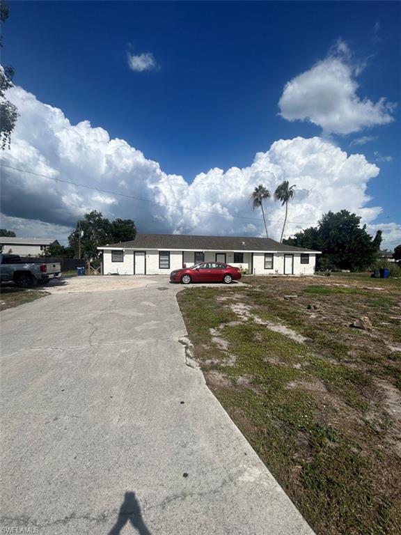 Rarely available TRI-PLEX in sought after San Carlos Park!!  Currently fully occupied.  Property just had a full exterior paint job, all new wood trim around windows and doors along with a lot of stucco repairs all done for new owner.  This is located in a very high demand area for investors.  Roof was done in 2014 and is in great shape.  Large corner lot.  Each unit has its own lanai.