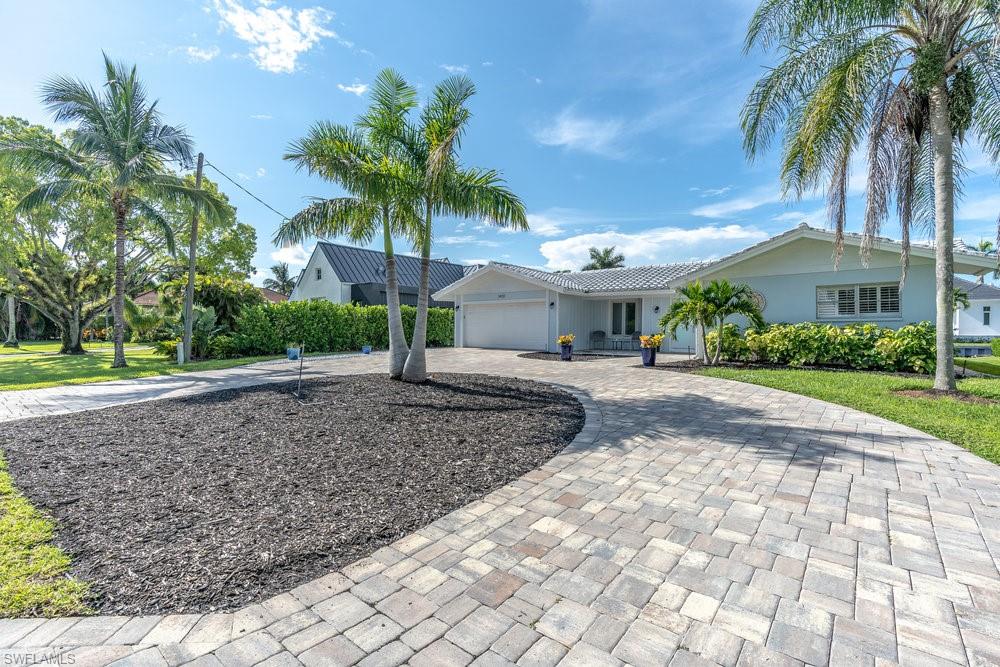 Prime location! Located on Marlin Dr only 6 lots from Naples Bay! Enjoy your sun-drenched pool, partial bay view & south facing exposure. Marlin Dr is a low traffic street with easy access to Naples Bay. This home has been completely updated & passed home inspection April 2021. Upgrades include: Brand new Electrical panel, new AC unit, all new electric/switch plates, new kitchen, new appliances including an induction flat surface stove top, new double oven, quartz counters, new high end large washer & dryer, new hot water heater, new paint, crown molding, custom wall woodwork including bead board ceilings, new brick paved horse-shoe driveway, new plumbing, & all new flooring. Spacious outdoor living area with new paved pool deck. Heated pool has been resurfaced with new coping/edging and colored lighting. Boaters will LOVE the quick no bridge access to the Gulf, newer dock (only 5 years old) brand new pilings & new lift. Grab a chair & watch sunsets from your partial Bay view, or fireworks from Naples pier during 4th of July. This is one of the last opportunities in Royal Harbor to own a south facing lot with option to build your dream home in future. Act fast this wont last long!
