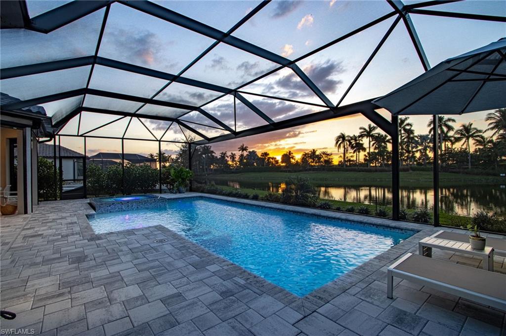 Why wait to build when you can move in right NOW!  Clean as a whistle with the coveted punch list completed.  Impeccably designed three bed plus den, three bath lakeview home.  Soak, swim and relax in the zero edge spa and upgraded pool.  The covered outdoor living extended lanai and custom designed outdoor kitchen will have your guests never wanting to leave.  Hurricane windows and doors throughout and a full home generator.  With press of a button hurricane shades will protect the lanai and provide additional shade. The attention to detail in every room of this home is off the charts. A must see to appreciate and fall in love with your new home in paradise. The new amenities at Esplanade by The Islands include resort style pool, Bahama bar, cafe and restaurant, wellness center and spa, five tennis courts, eight pickleball courts and three bocce ball courts.  Fine dining and culinary center is coming in hot.  All furnishings are negotiable. Schedule your private showing today!