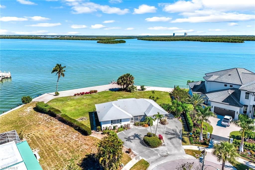 This unique & incredible 0.54-acre wedge-shaped lot is situated at the tip of a tranquil cul-de-sac, offering an impressive 200 feet of deep-water access on the beautiful Marco River and an additional 31 feet along the side canal. This prime location not only provides breathtaking and sweeping views of the Marco River but also offers a picturesque outlook onto the Thousand Islands Preserve, creating a serene backdrop for your future home.

Being just a short distance from the restaurants, shops, and activities of Marco Island, this lot provides the perfect balance between convenience and tranquility. You have the opportunity to design and construct a spacious estate home that maximizes outdoor living and green space, ensuring that every room captures the stunning natural beauty surrounding the property.

The extensive seawall frontage is a valuable asset, allowing for numerous docking options to accommodate any sized yacht or watercraft, all while maintaining unobstructed views. Rebuilding and possibly extending the existing deep-water dock simplifies the permitting process, making it easier for you to create your own private waterfront oasis.

Imagine enjoying everyday life while watching dolphins and manatees frolic just beyond your backyard. With direct and quick boating access to the Gulf of Mexico, you can easily explore the open waters, enjoy fishing trips, or simply take in the sunset from your vessel. This lot presents a rare and exceptional opportunity to own a piece of paradise in one of Florida’s most desirable locations.