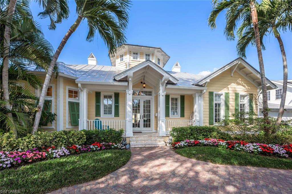 Attention Beach lovers! High and dry elevation 4 bedrooms each with private bath,dinning room, fireplace in living room. Sun filled family room with sliding glass doors to the pool and spa. Circular driveway, colorful gardens and a story book setting in the heart of the Historic District. Front porch with coral stone decking. Special features include metal roof, cypress bead board outdoor ceilings, wide plank antique pine flooring, his and hers bathrooms and closets. Every room opens to the sunny private courtyard to pool and spill over spa and waterfall. Located just a block to beach and alley access to 3-car air conditioned garage.  The rental potential is 12 times /a year 30 day min. Prime location in the heart of Old Naples just steps to favorite restaurants,coffee shops, boutiques, parks, art galleries, farmers market and of course SUNSETS!