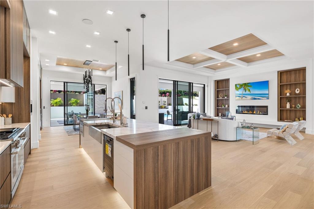 This Exquisite Brand New Construction residence is built on a 1/2 acre lot with Southern exposure, boasting a total of 6591 sq. ft. under roof.  A true trophy property in the desirable Estates of Marco Island that exhibits resort-style living.

The exterior showcases smooth stucco finishing in custom white, complemented by a charcoal-colored cement tile roof. Glass garage doors and a driveway crafted from concrete blocks with a unique and exclusive design add to the home's curb appeal. The meticulously landscaped yard features an oversized swimming pool w/ a built-in spa, outdoor kitchen and a putting green for non-stop entertainment!  

As you make your way through the grand entrance, the list never ends since the home is packed with upgrades such as white oak plank flooring throughout the home, custom Italian kitchen cabinets, custom vanities, natural stone countertops, top-of-the-line appliances, designer fixtures, 6' electric fireplace in living room & an outdoor fireplace, smart home features throughout, limestone stucco finish in the living room TV wall, 2 hvac system w/3 zones, all doors are pre-wired for blinds, built in hardwired speakers, camera security system, 500 gallon buried propane that is generator ready...… I wish I could go on and write a book on this home, but unfortunately, I am limited to couple of paragraphs.  This exquisite property is a rare find and should be on your list of properties to preview.  Homes of this caliber do not often come on the market