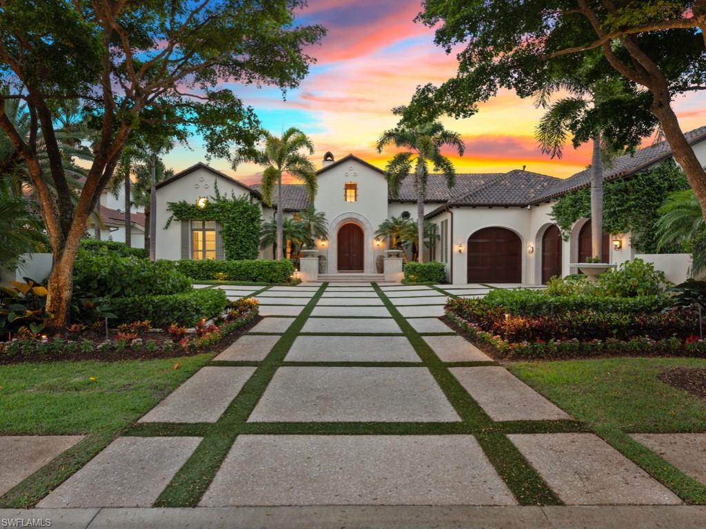 Exquisite wide-water views define this custom Grand Estate Home rarely available in Miromar Lakes Beach & Golf Club. Situated upon a prime waterfront site in the exclusive gated enclave of Castelli this property is the one-of-a-kind opportunity for the discerning buyer looking for the finest finishes and amenities in their Florida retreat. The home’s artistry begins at the grass-paver motor-court. Designed with family-focused living in mind, this residence offers 4 bedrooms, 6 baths, formal dining room overlooking a beautiful Zen-garden fountain pool, a resort-style L-shaped custom pool and spa, expansive outdoor living room, al fresco dining area, fireplace, beautifully crafted wood-paneled study, spa-like master retreat and more. The chef's gourmet kitchen is equipped with professional-grade Thermador appliances, dual refrigerators and ovens and butler's pantry. Fully-pocketing sliding doors allow a seamless indoor-outdoor connection, for elegant entertaining enriched by the Lutron lighting system and fully integrated audio visual system.  Boat directly from your private dock to the community's award-winning amenities, cruise with friends and watch the spectacular sunsets.